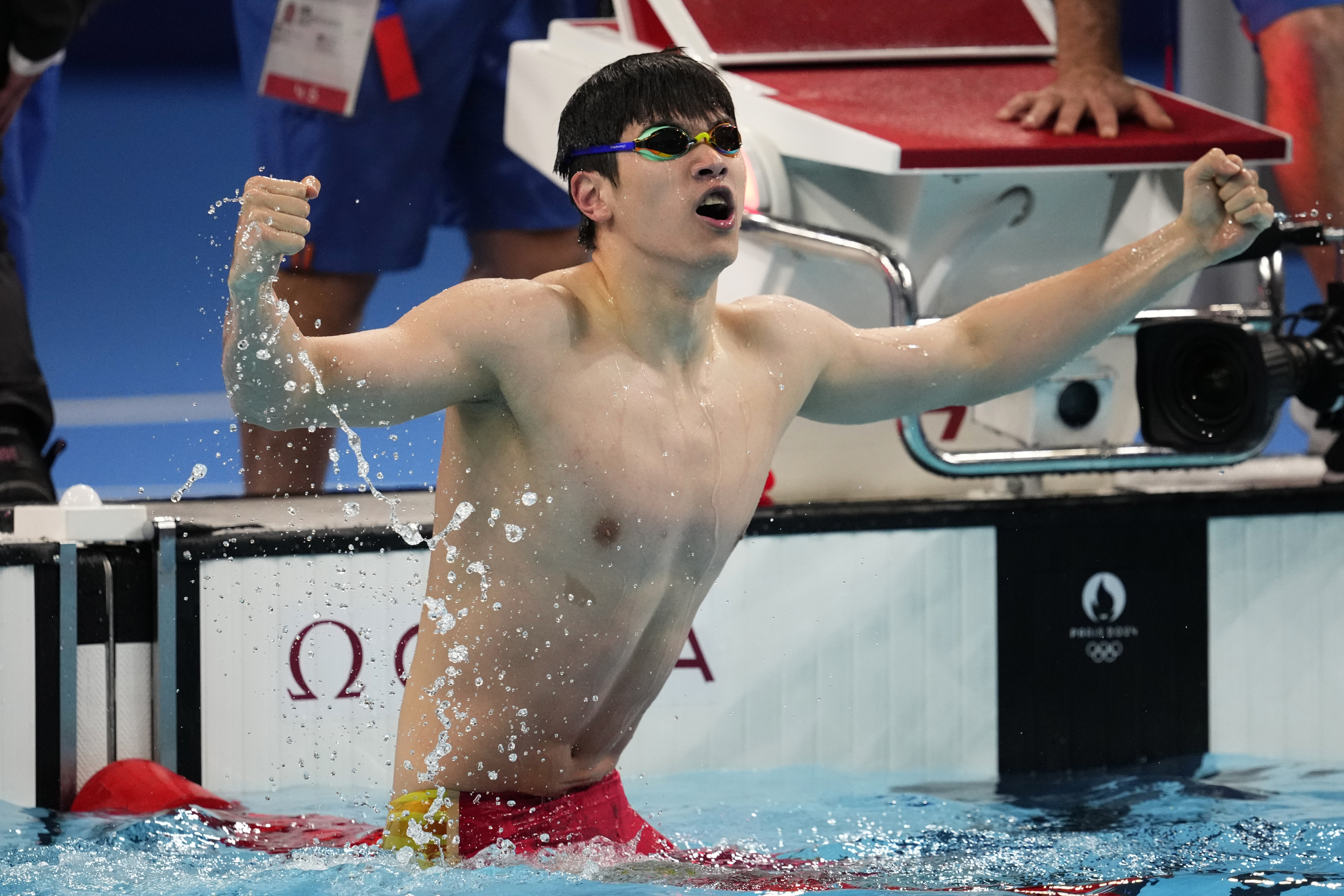 Pan Zhanle, of China, celebrates after winning the men's 100-meter freestyle final at the 2024 Summer Olympics, Wednesday, July 31, 2024, in Nanterre, France. (AP Photo/Petr David Josek)