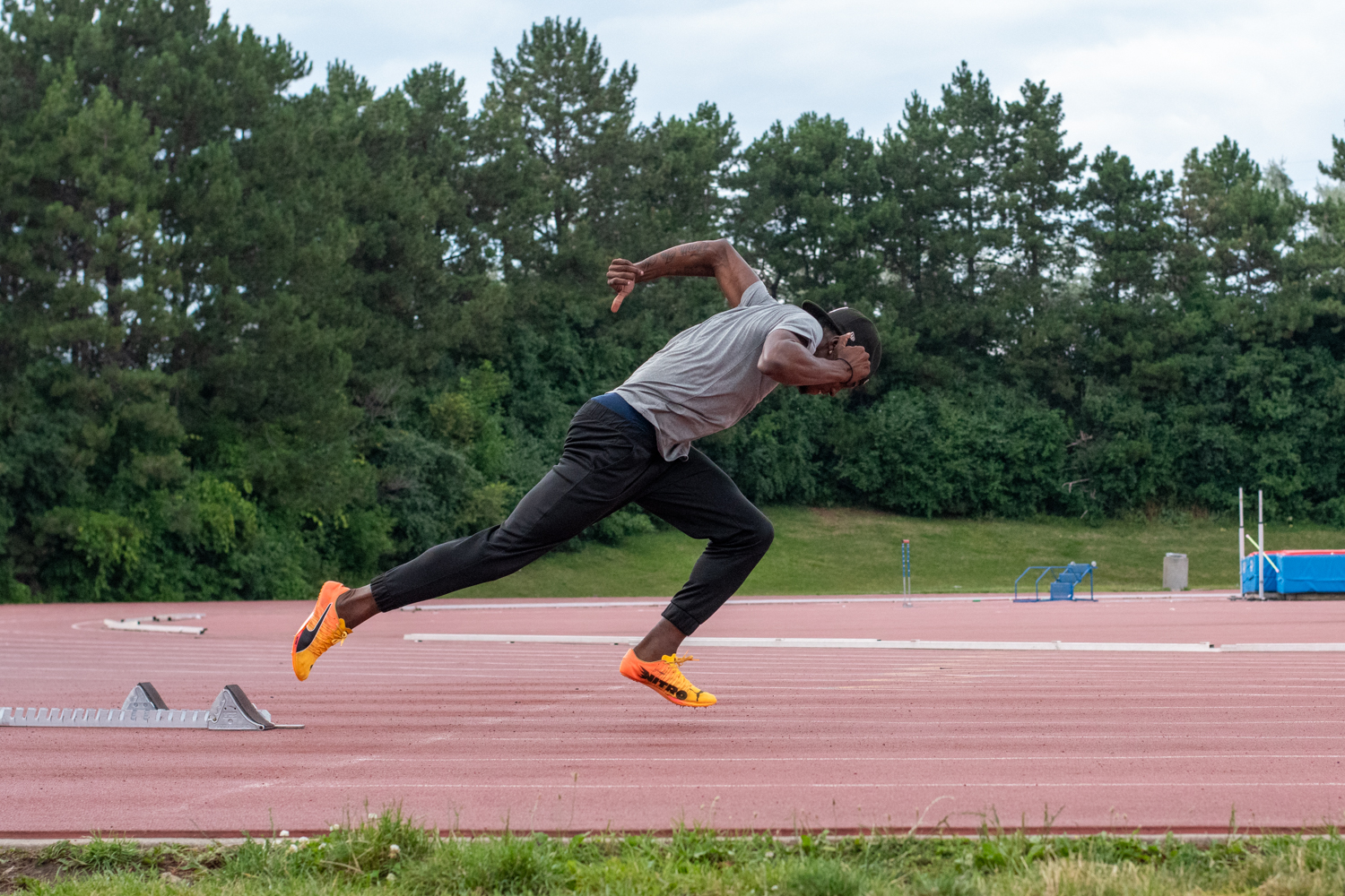 Tamarri Lindo sprints across an outdoor track.