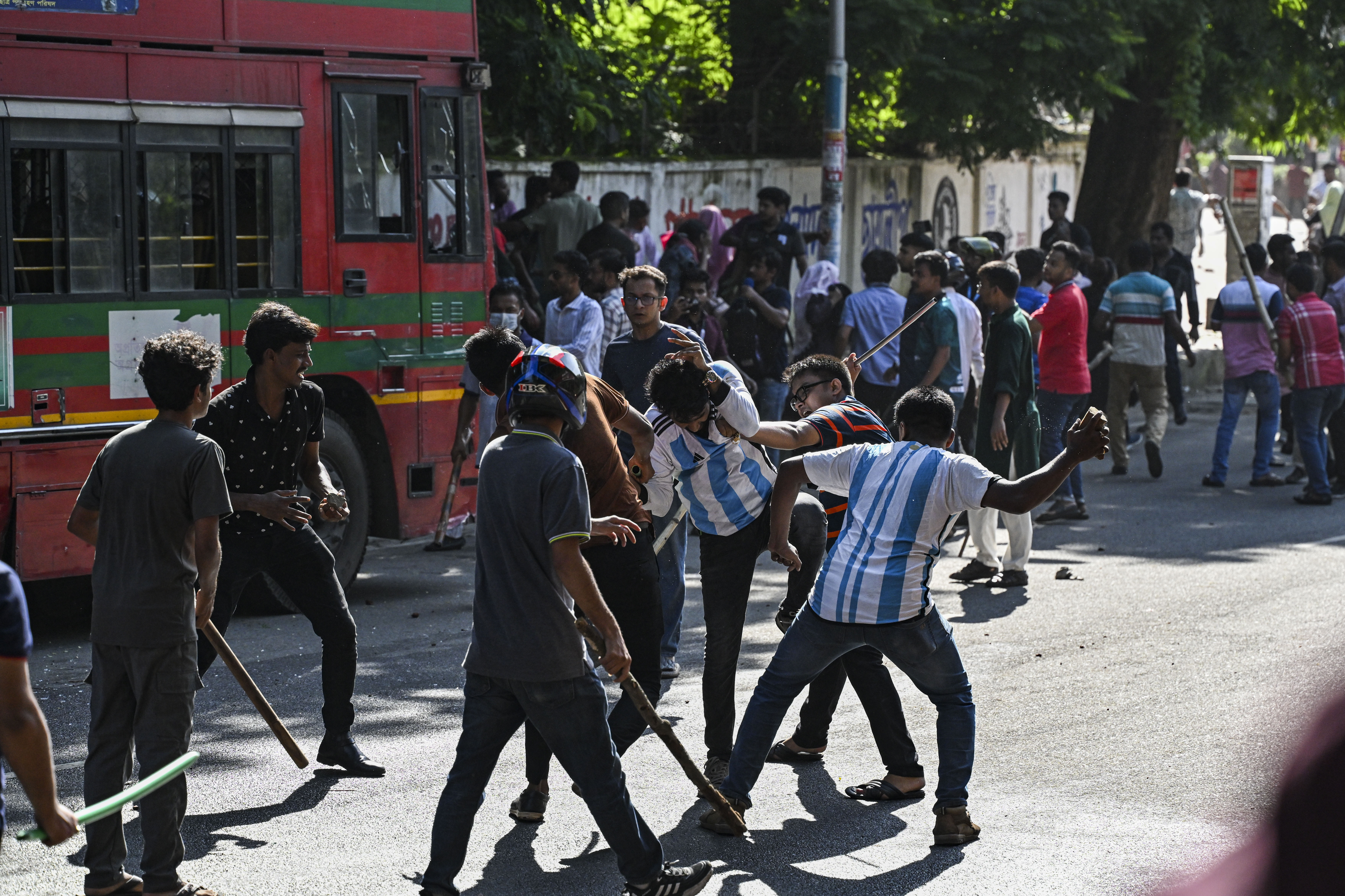 Anti-quota protesters and students backing the governing Awami League party clash on Dhaka University campus
