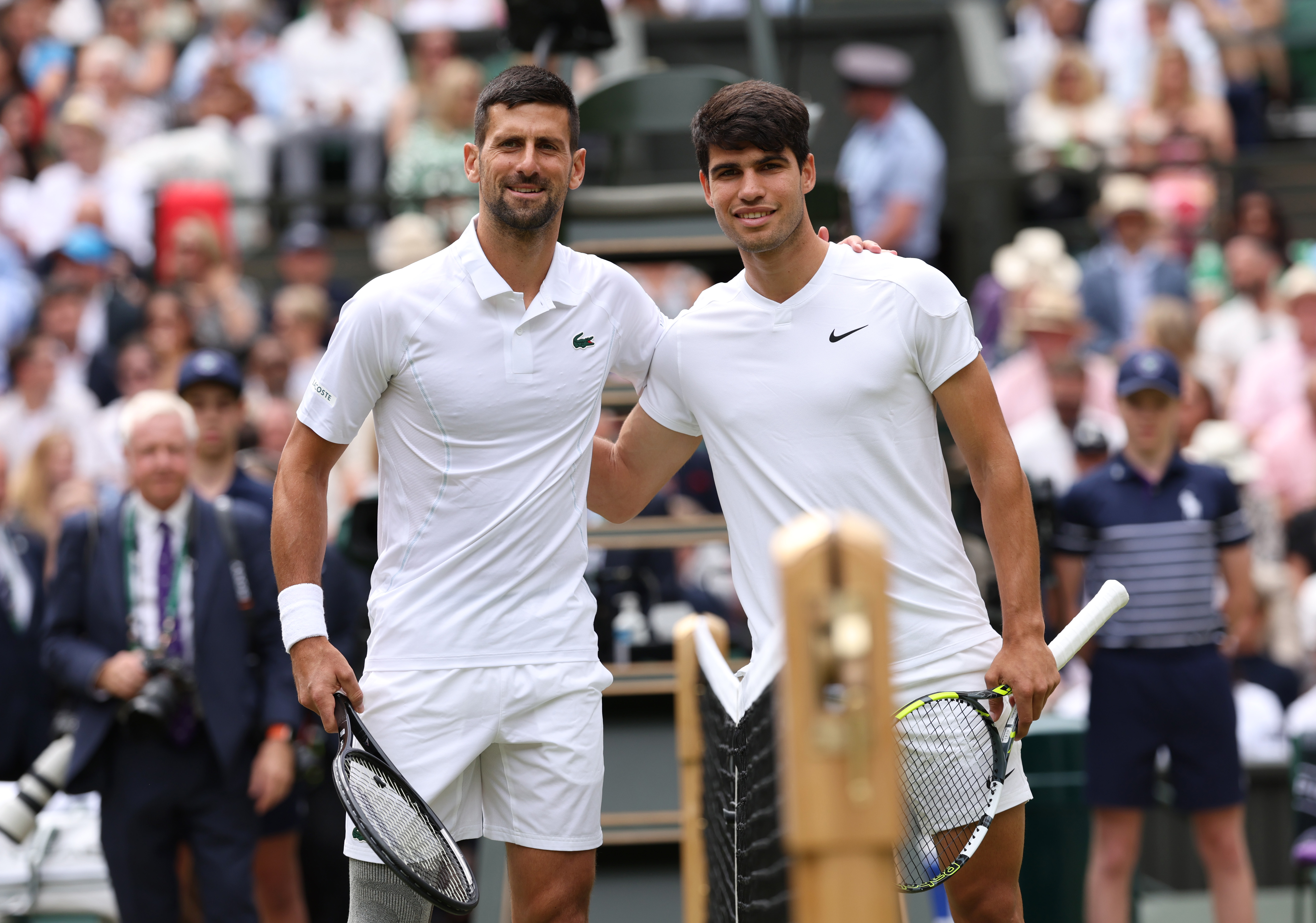 Tennis players meet at centre court before match.