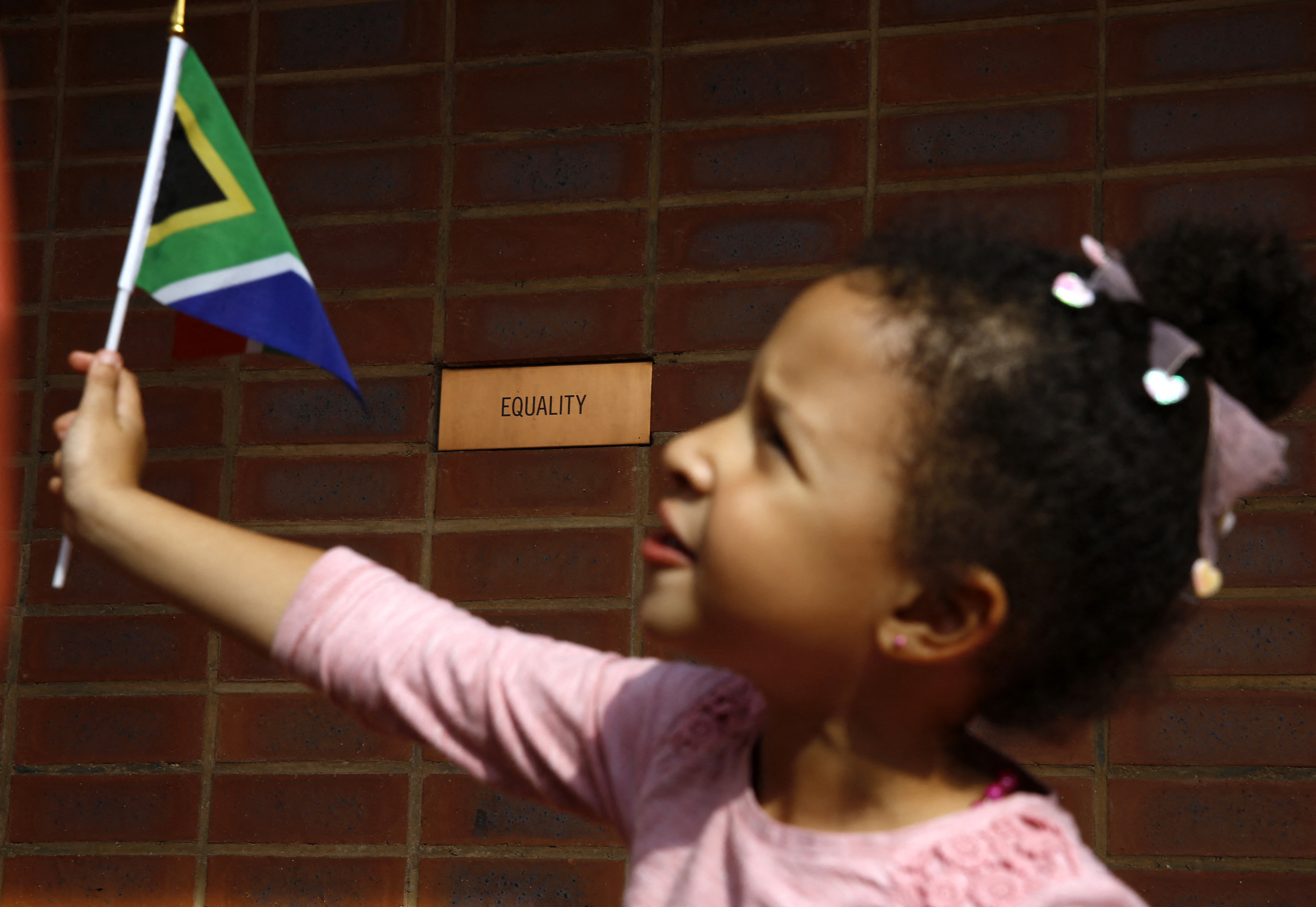 A girl with a South African flag