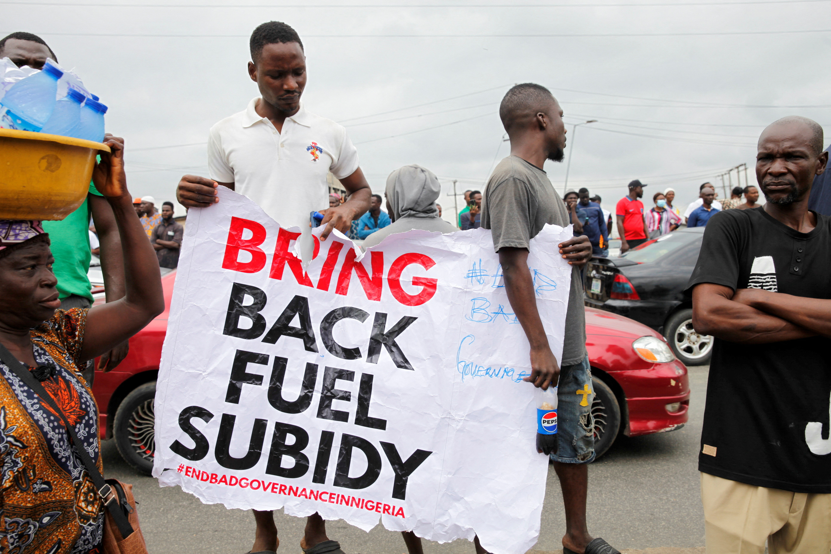 Demonstrators gather as they participate in an anti-government demonstration, to protest against bad governance and economic hardship in Lagos