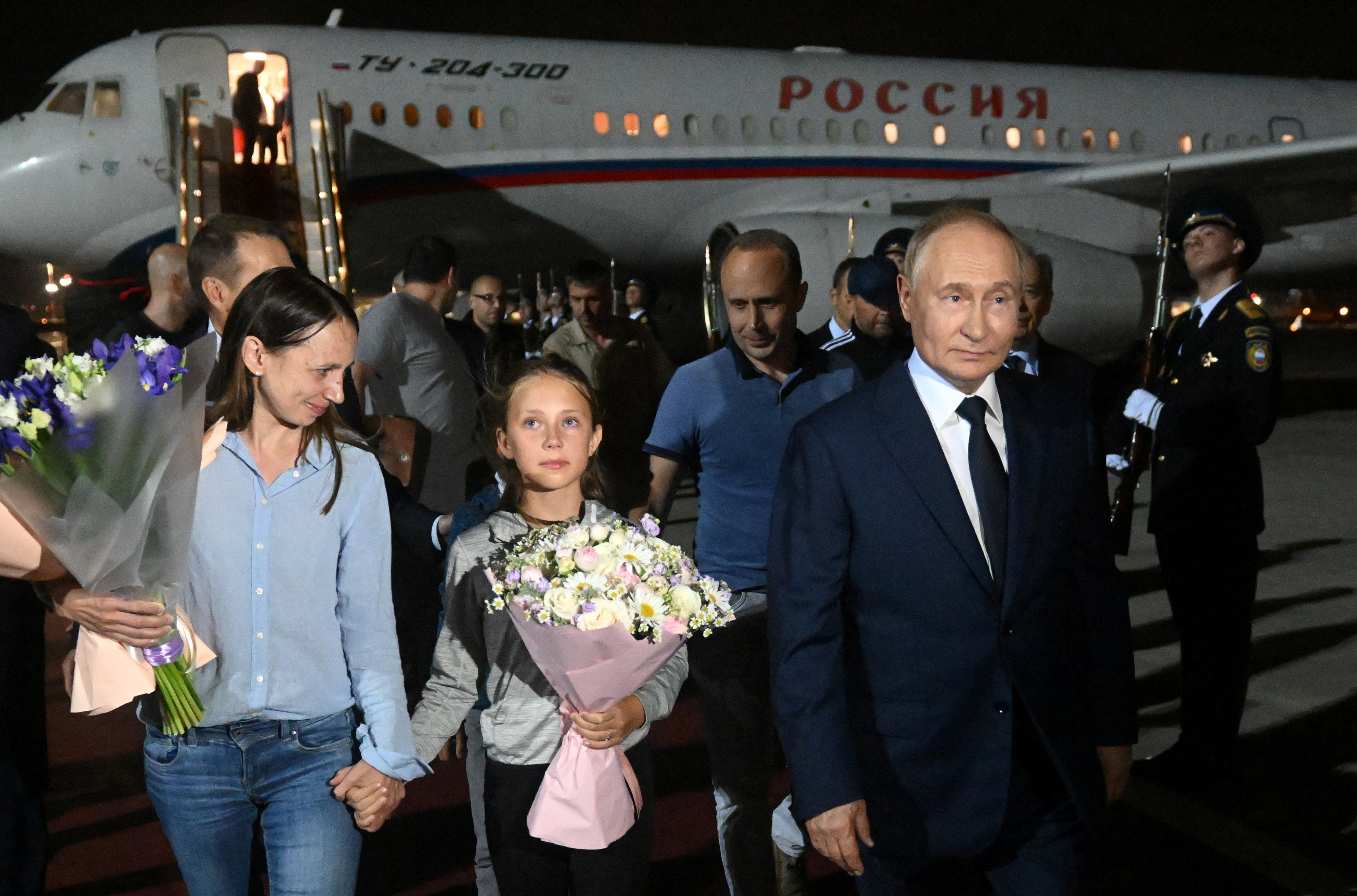 Russian President Vladimir Putin welcomes Russian nationals, including Artyom Dultsev, Anna Dultseva and their children, following a prisoner exchange between Russia with Western countries, during a ceremony at Vnukovo International Airport in Moscow, Russia August 1, 2024. Sputnik/Mikhail Voskresensky/Pool via REUTERS ATTENTION EDITORS - THIS IMAGE WAS PROVIDED BY A THIRD PARTY.