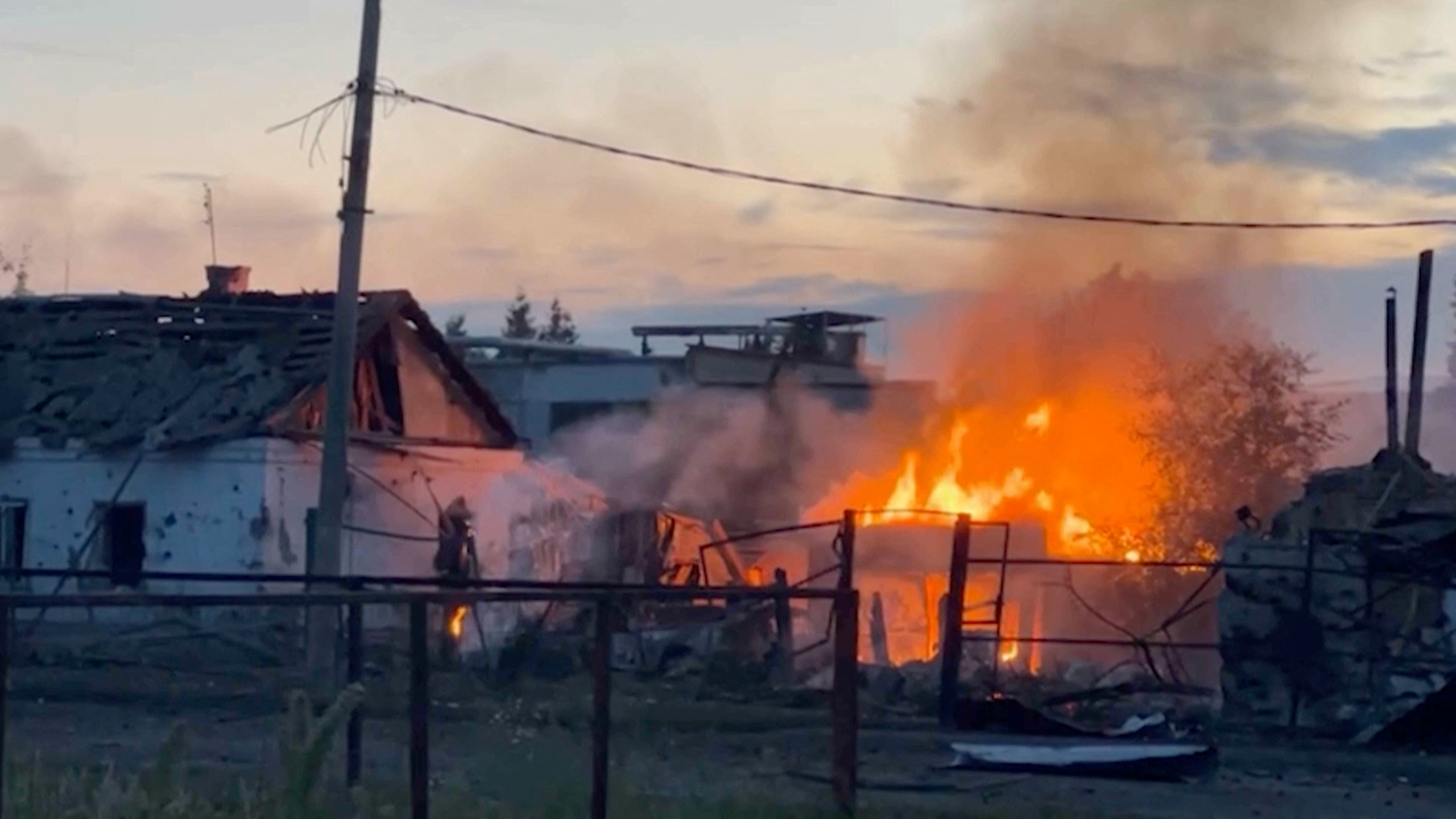 A view shows a building on fire in the town of Sudzha following an incursion of Ukrainian troops into the Kursk region of Russia