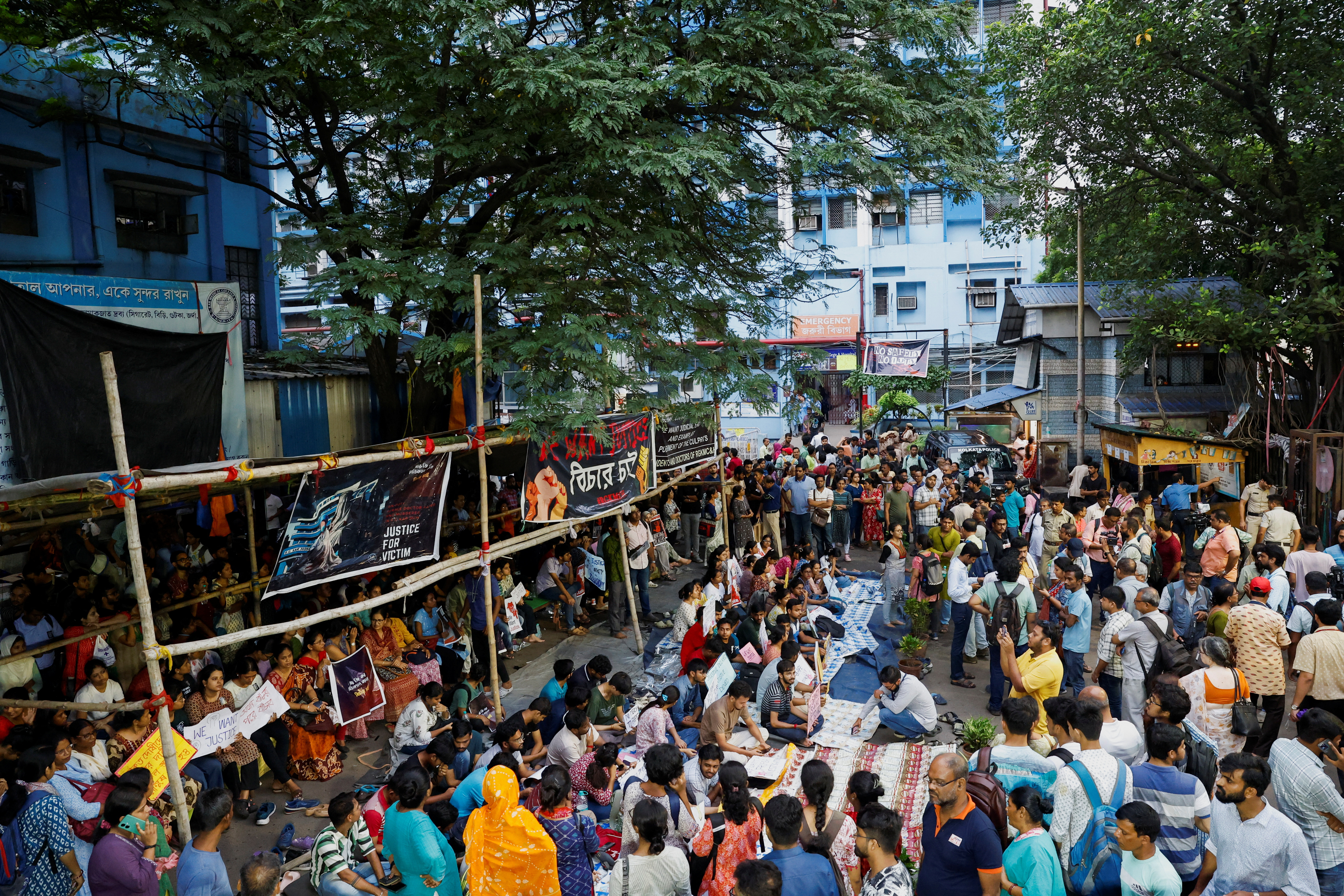 Doctors, paramedics and medical students gather as they attend a protest against what they say was rape and murder of a trainee doctor, inside the premises of R G Kar Medical College and Hospital in Kolkata, India, August 13, 2024. REUTERS/Sahiba Chawdhary