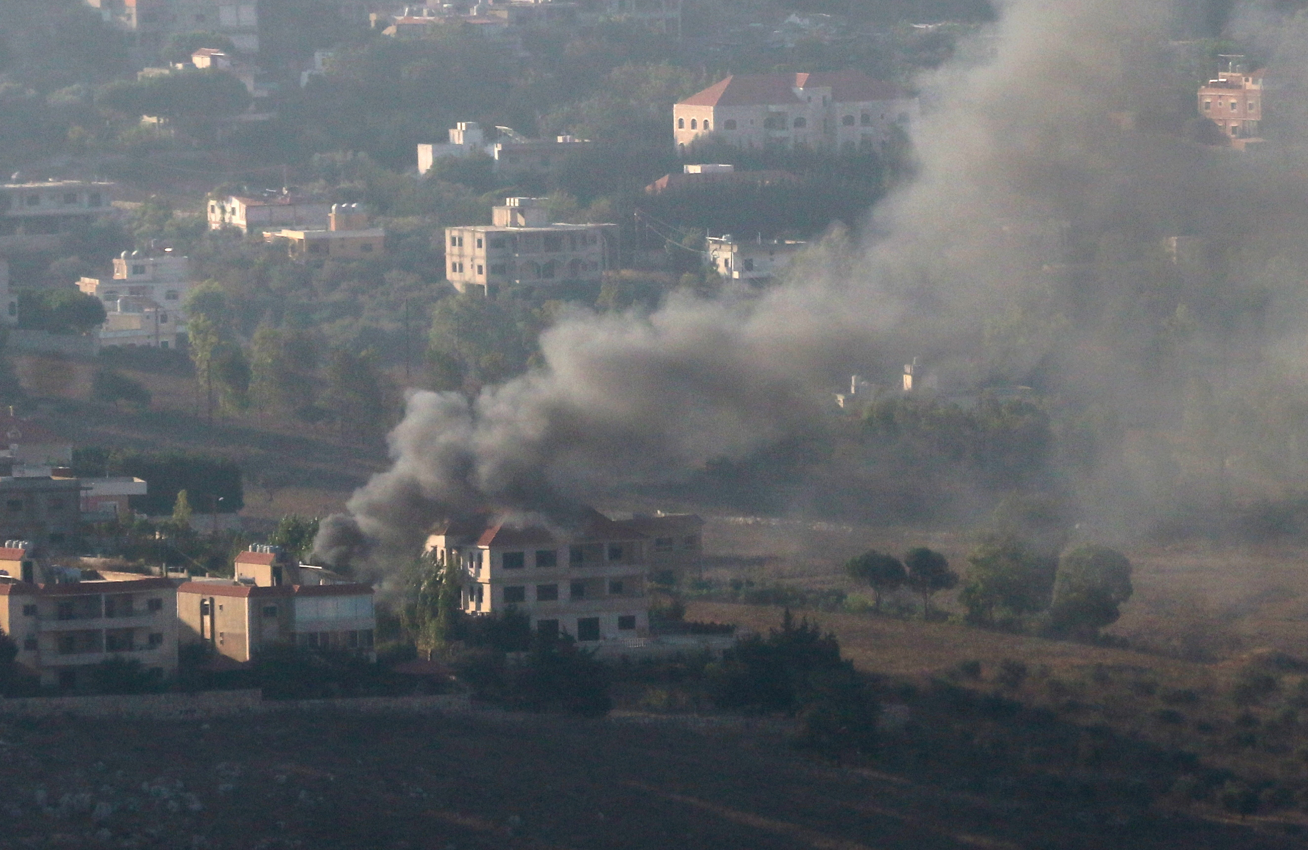 A view shows smoke and fire on the Lebanese side of the border after Israel's attacks