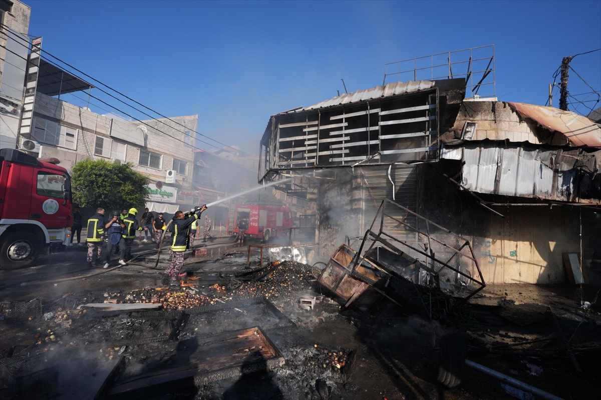 a firefighter puts out a fire