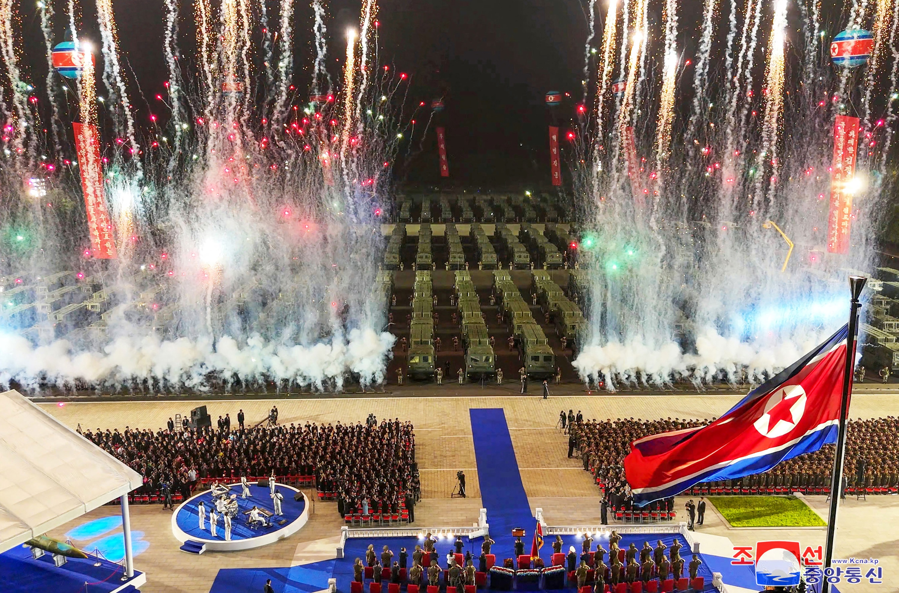 Fireworks illuminating the missile launchers and troops at Sunday night's ceremony in Pyongyang.