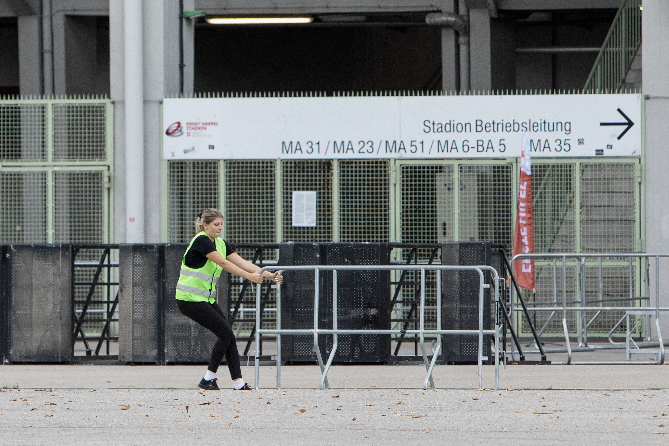 Security guards remove barriers in front of the Ernst Happel Stadium in Vienna