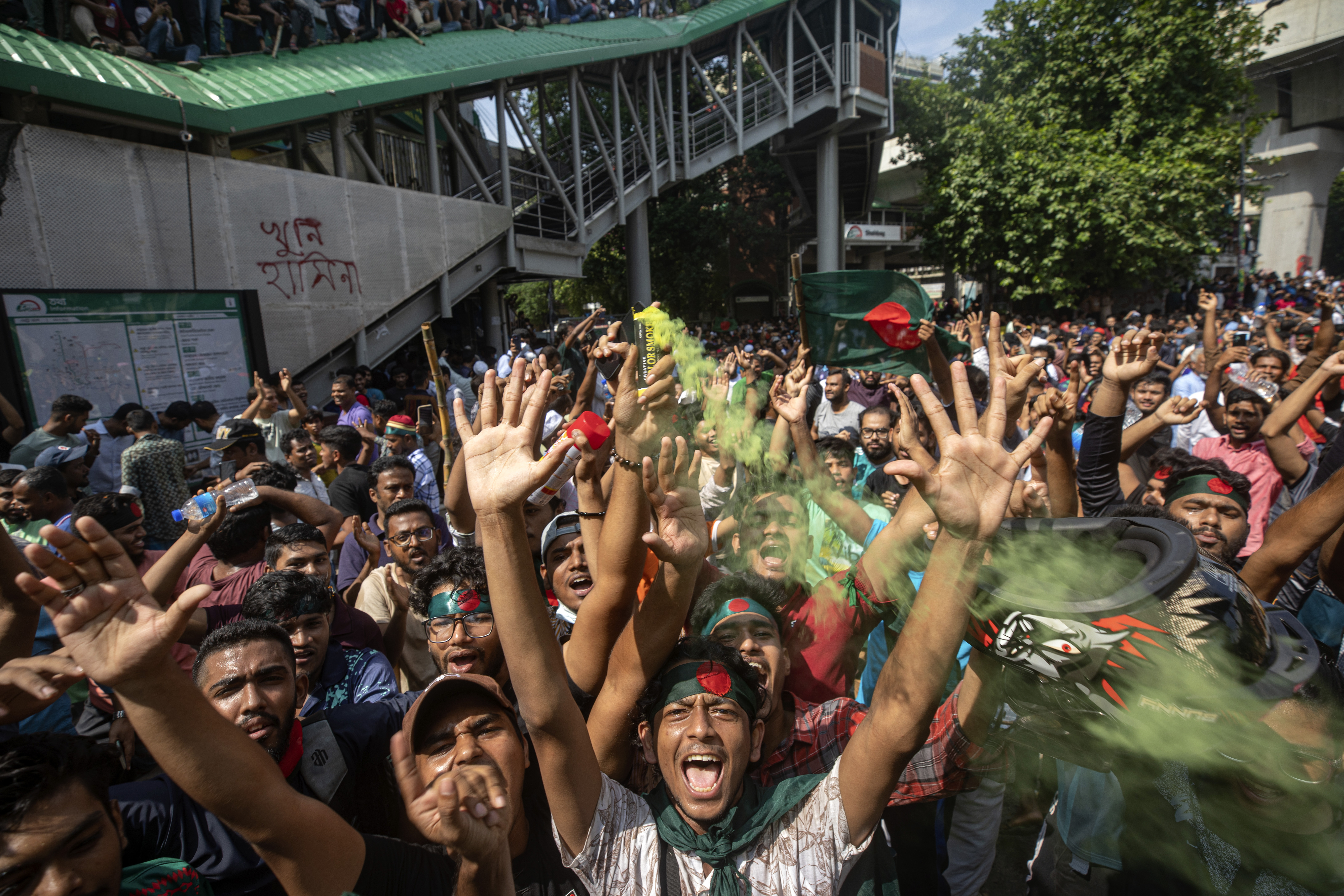 Protesters shout slogans as they celebrate Prime Minister Sheikh Hasina's resignation, in Dhaka, Bangladesh