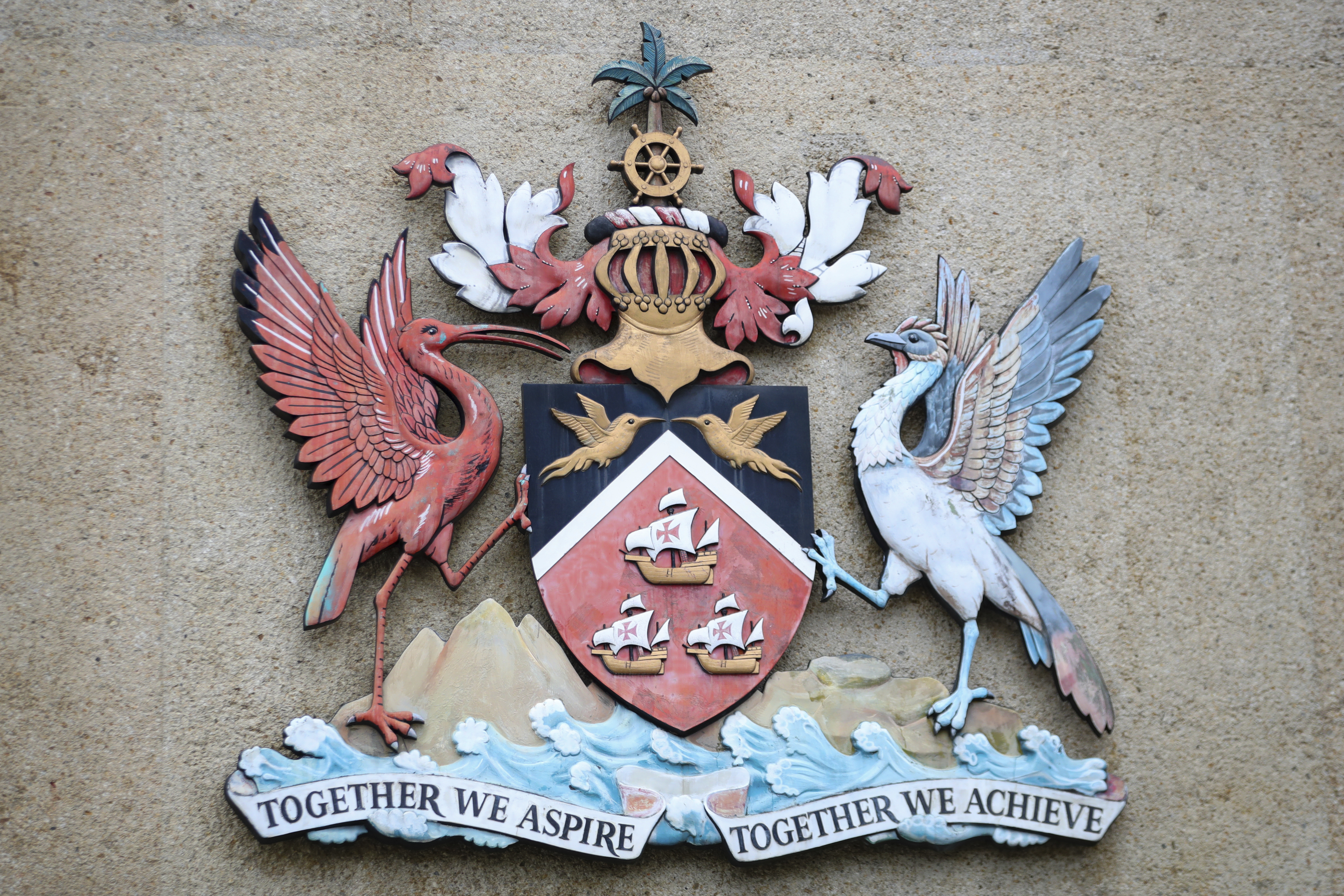 The country's coat of arms hangs at the entrance of a government building in Port-of-Spain, Trinidad and Tobago