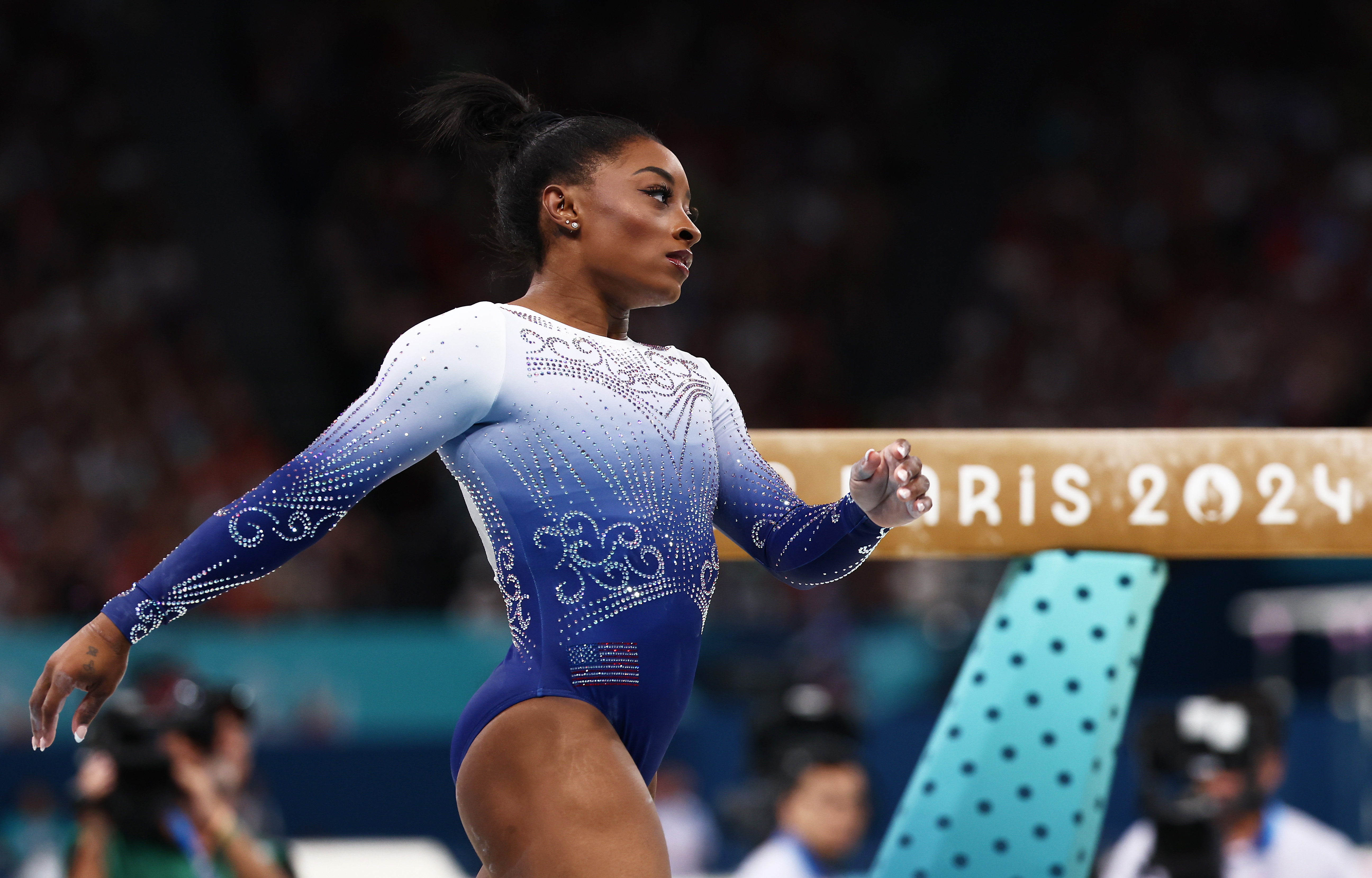 Simone Biles walking after beam routine.