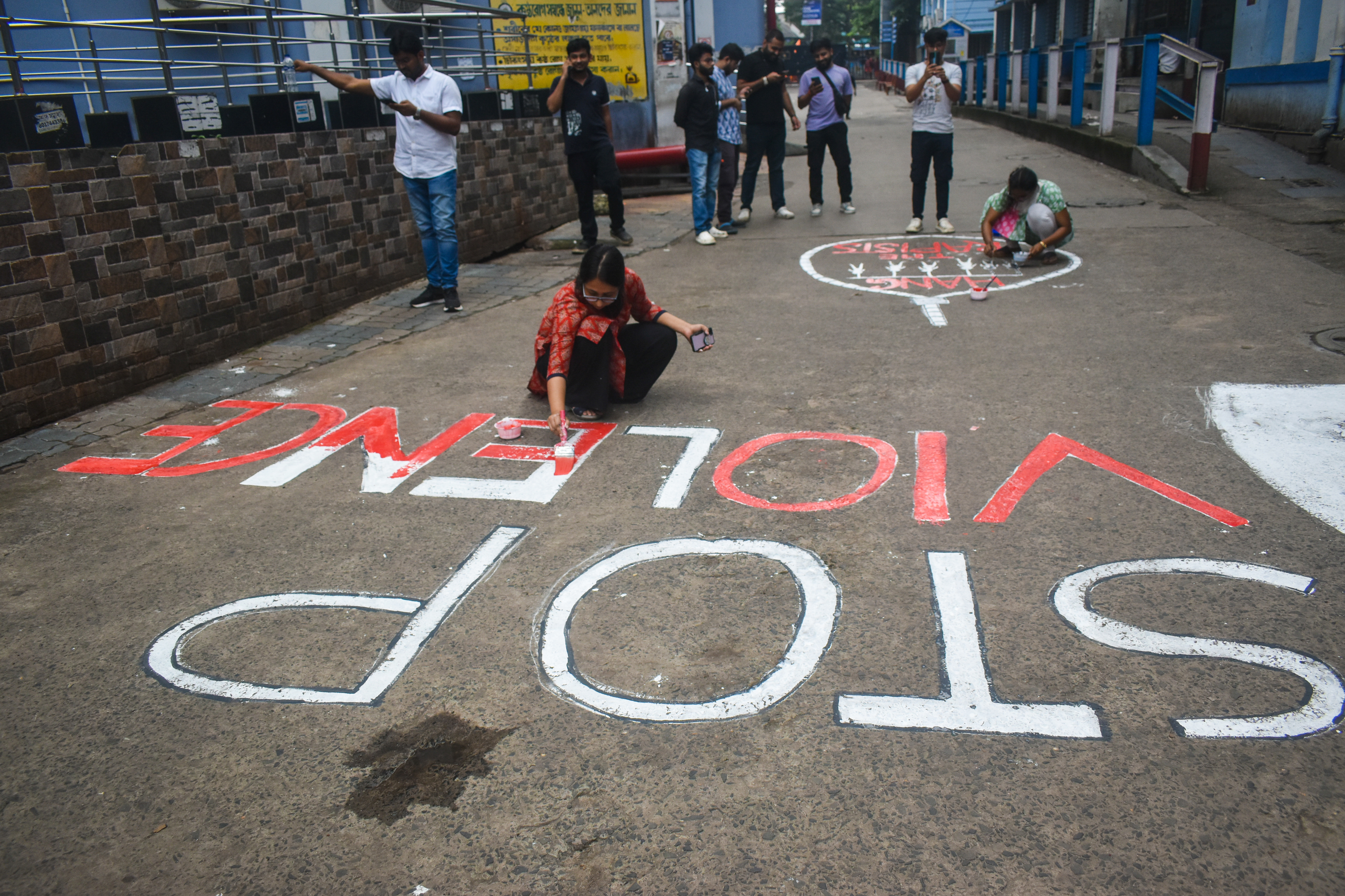 Doctors paint a mural with slogans inside R G Kar Medical College and Hospital campus condemning the rape and murder of a trainee medic at a government-run hospital, in Kolkata, India, on August 25, 2024. (Photo by Sudipta Das/NurPhoto via Getty Images)