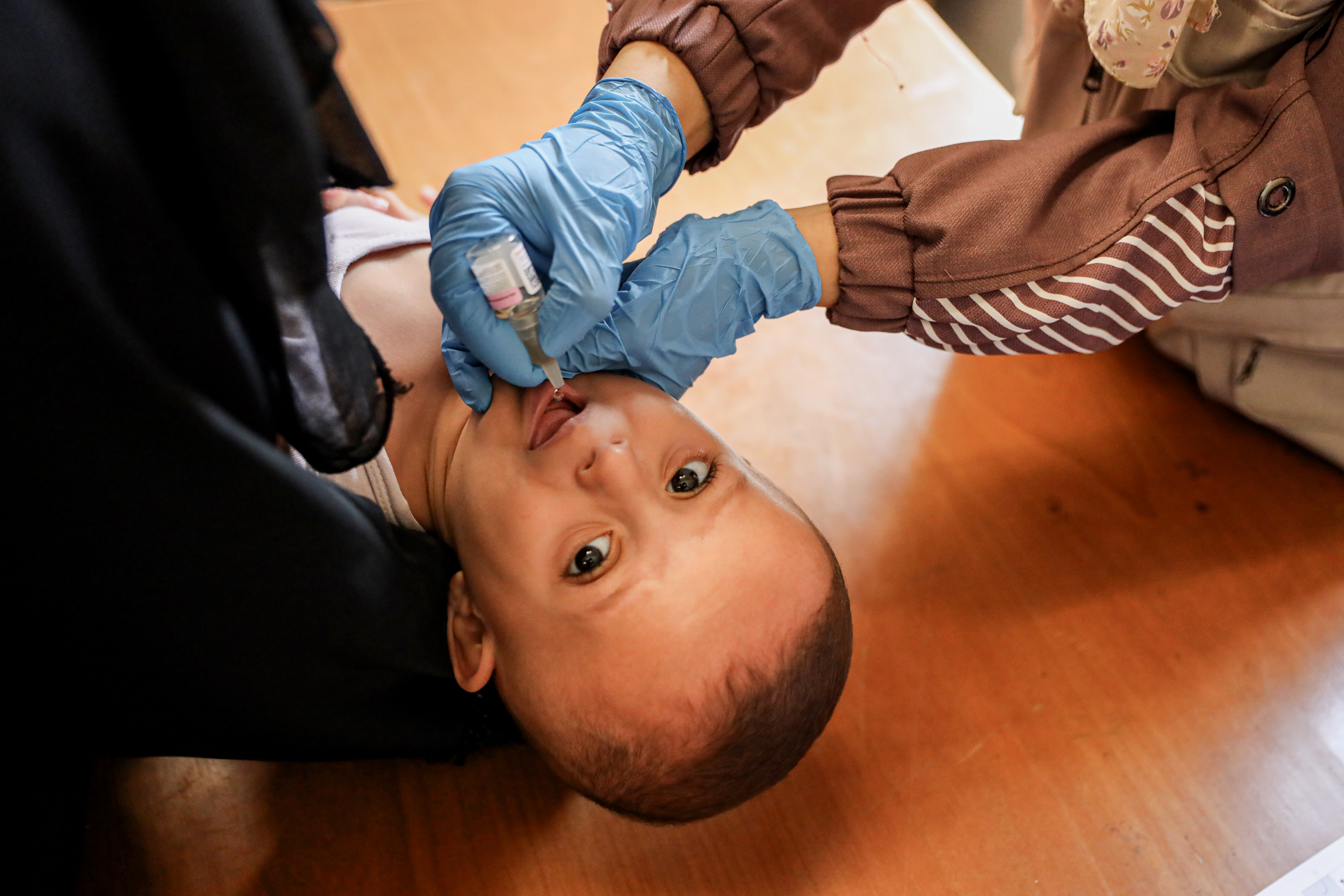 Polio in Gaza [Abdelhakim Abu Riash/Al Jazeera]