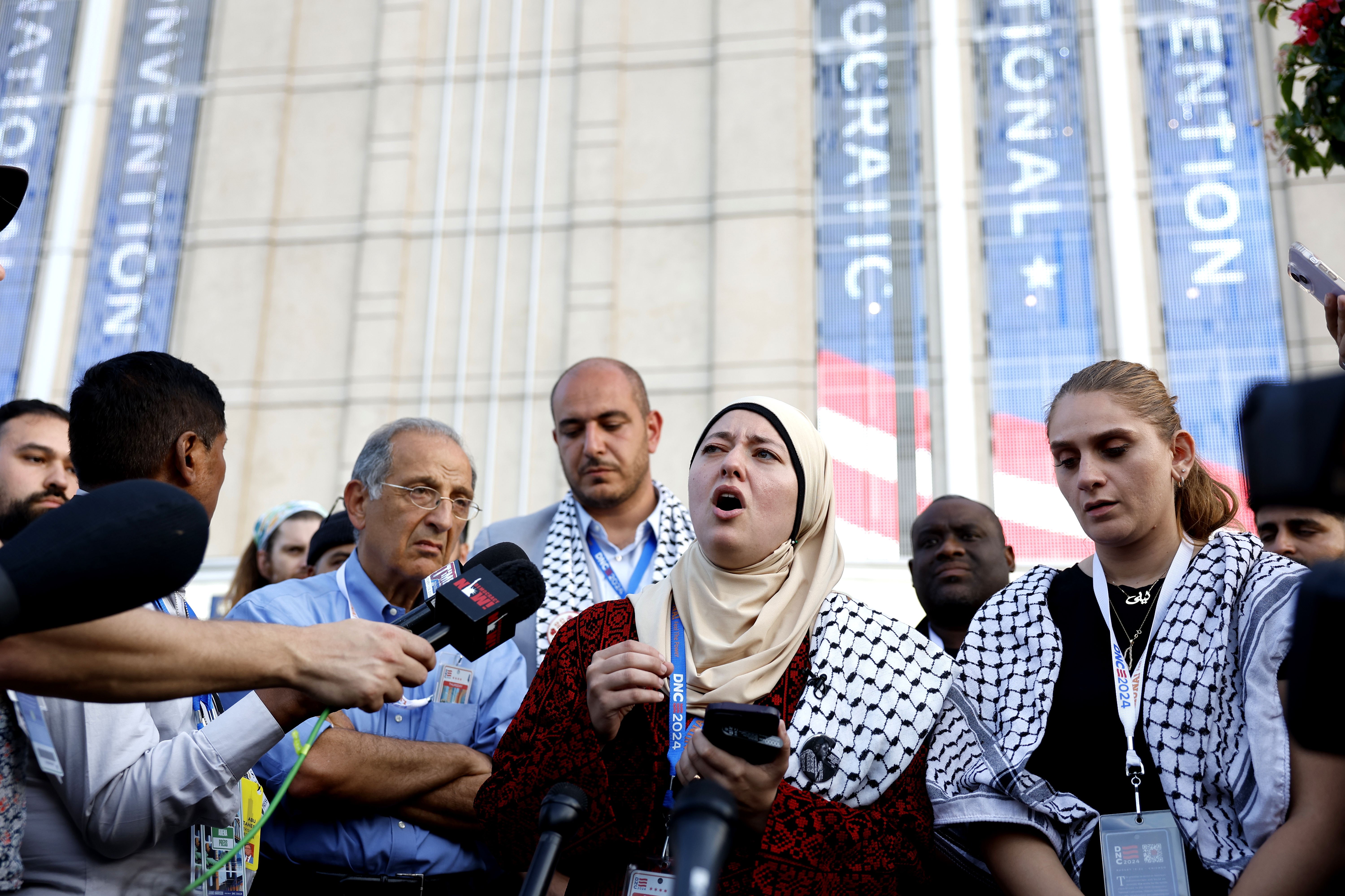 Ruwa Romman speaks to the press outside the DNC.