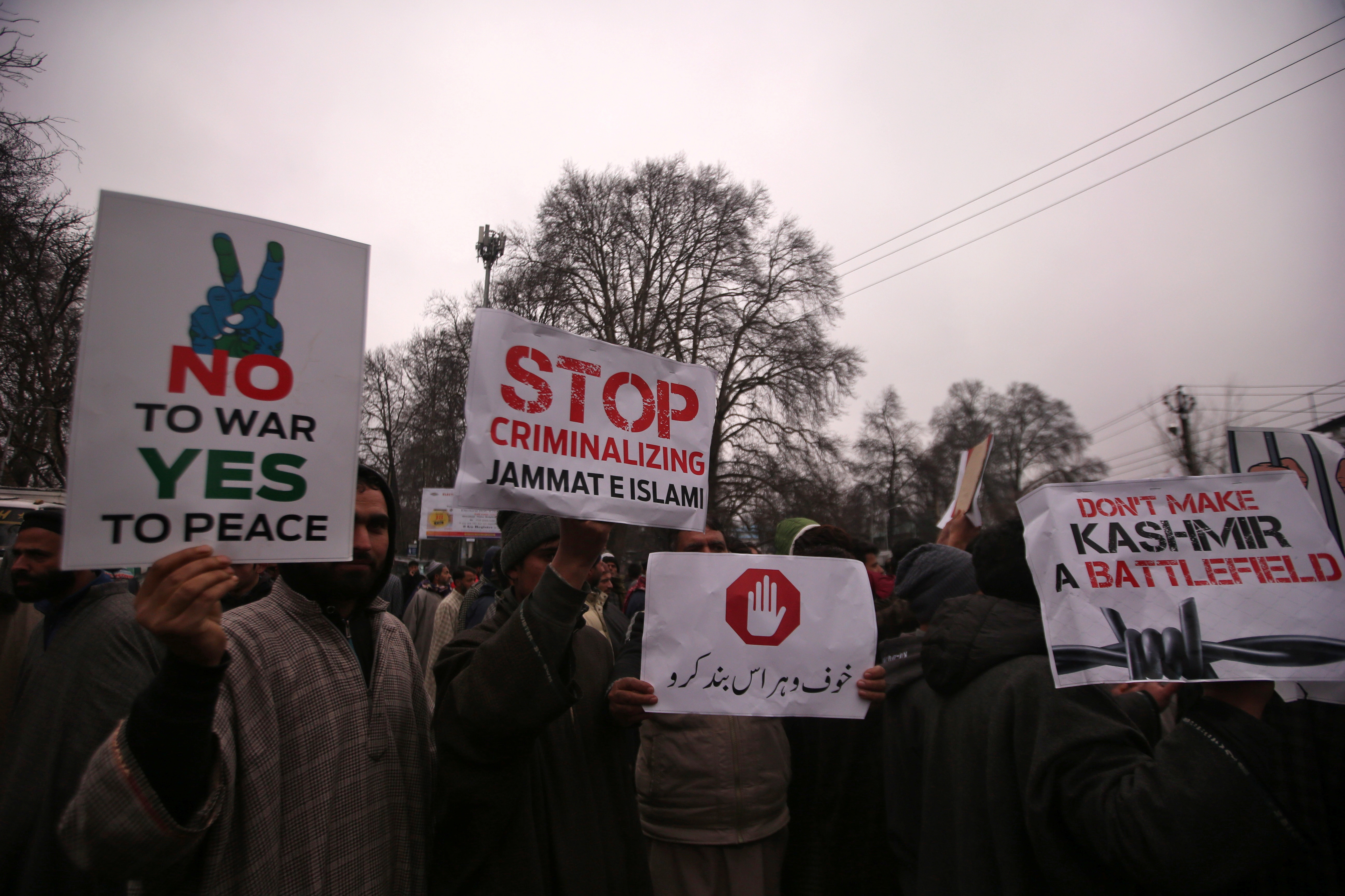 Supporters of the Peoples Democratic Party (PDP), a pro-India political party, hold up placards during a protest against the ban on a Kashmir-based Islamist political party called Jamaat-e-Islami (JeI), in Srinagar March 2, 2019. REUTERS/Danish Ismail