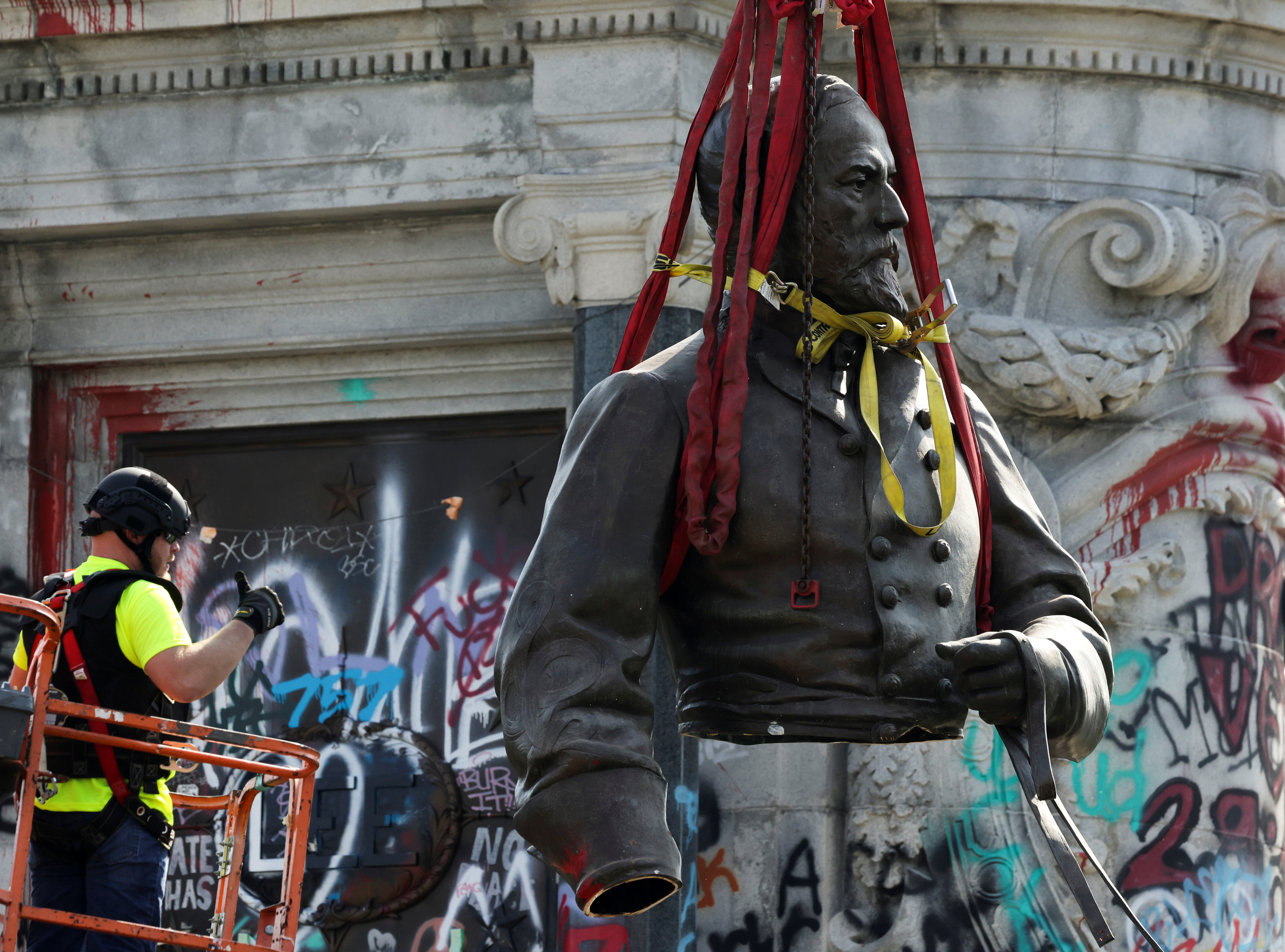 A statue of Robert E Lee is dismantled in Richmond.