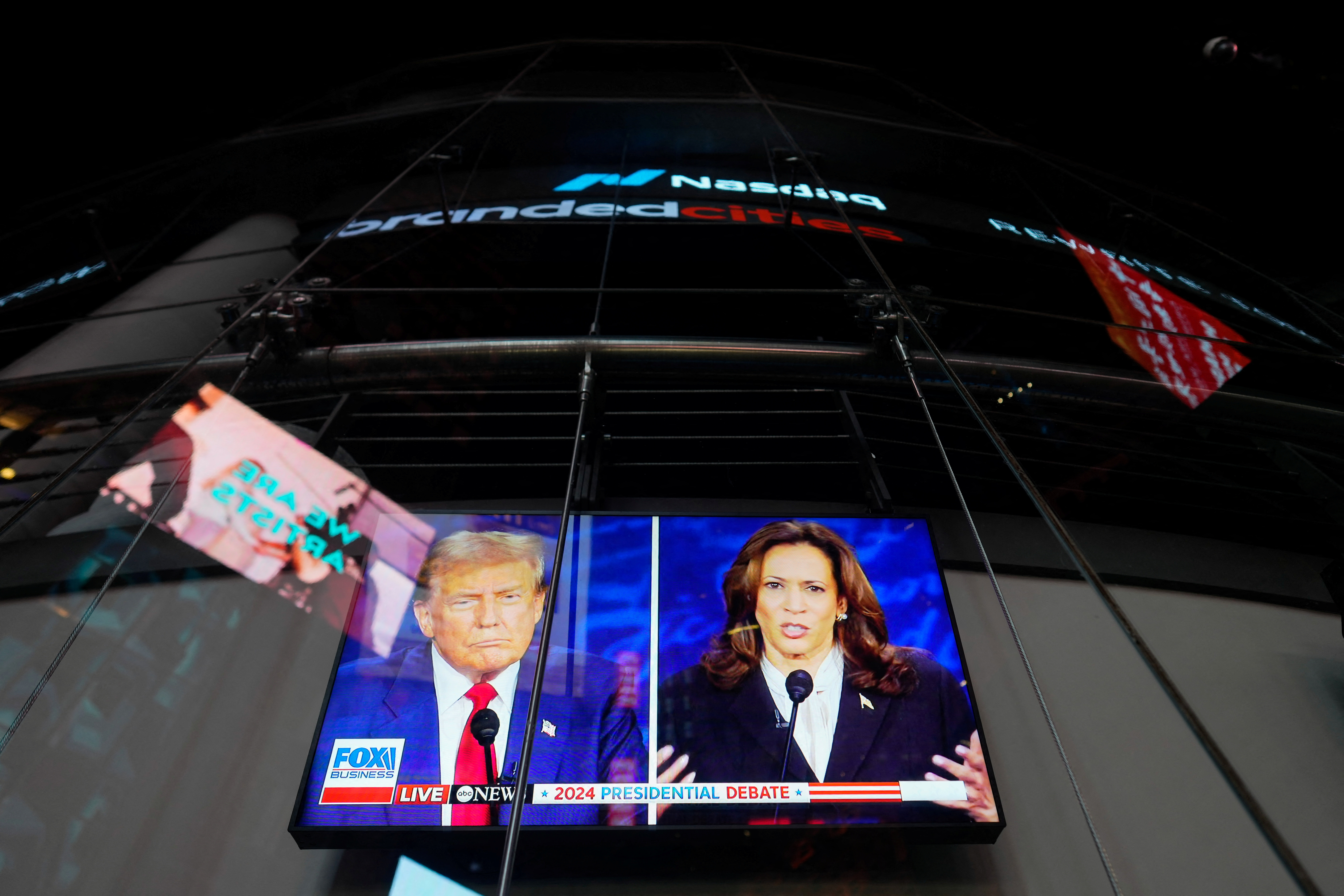 A screen shows the US presidential debate