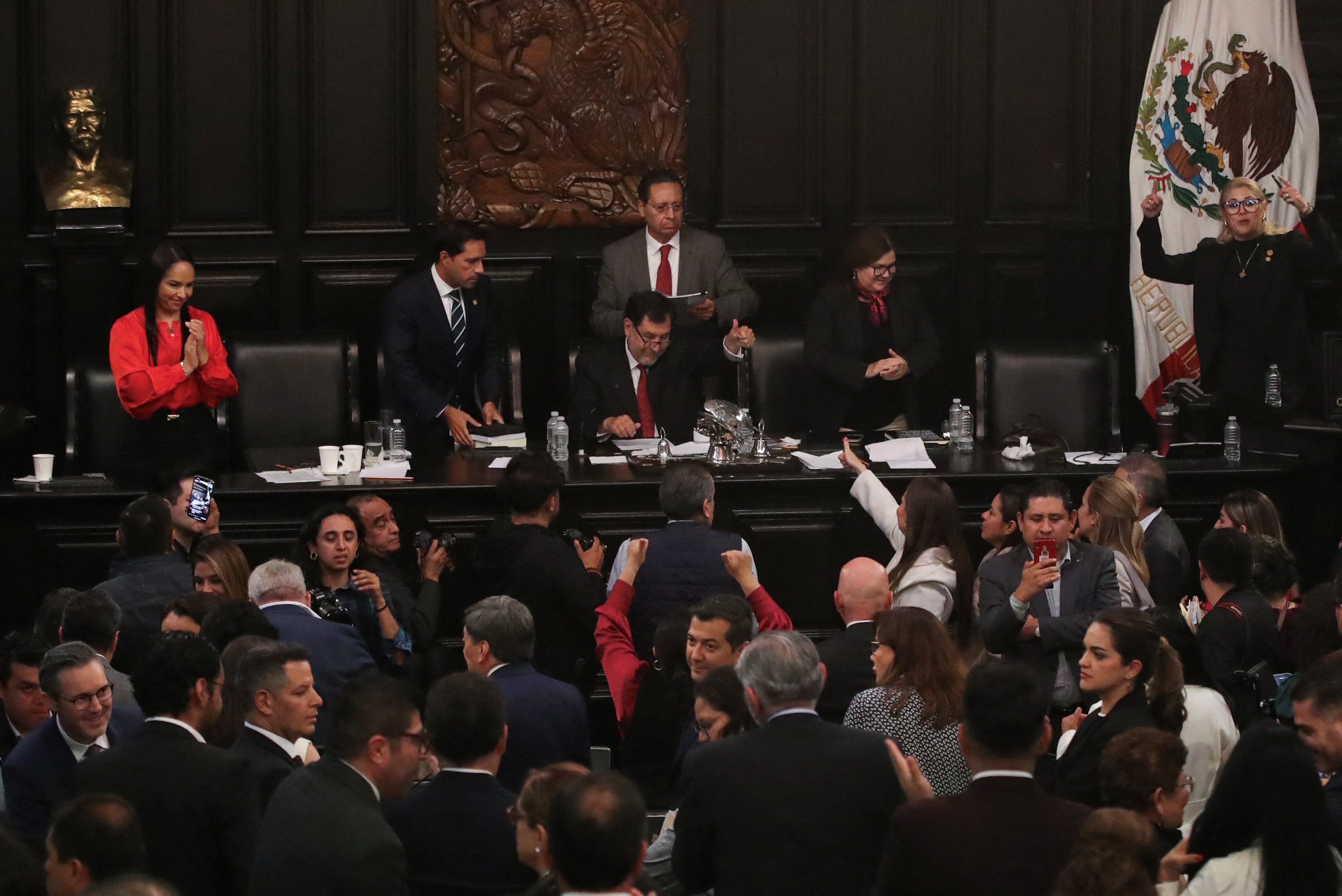 Senator Gerardo Fernandez Norona celebrates with senators, after members of Mexico's Senate passed the highly contested proposal on judicial reform presented by the government of President Andres Lopez Obrador