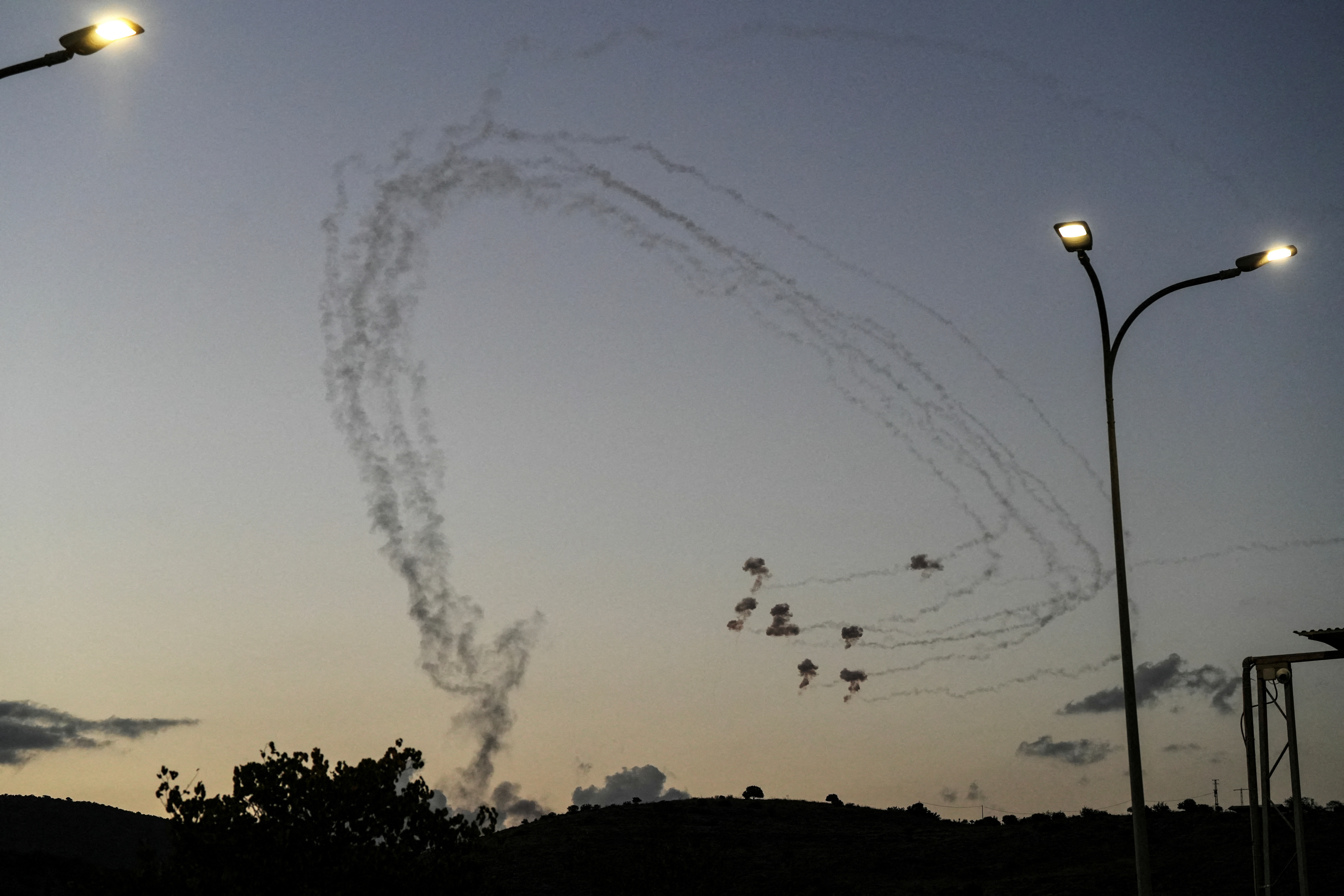 Trails from rockets fired across the border into Israel
