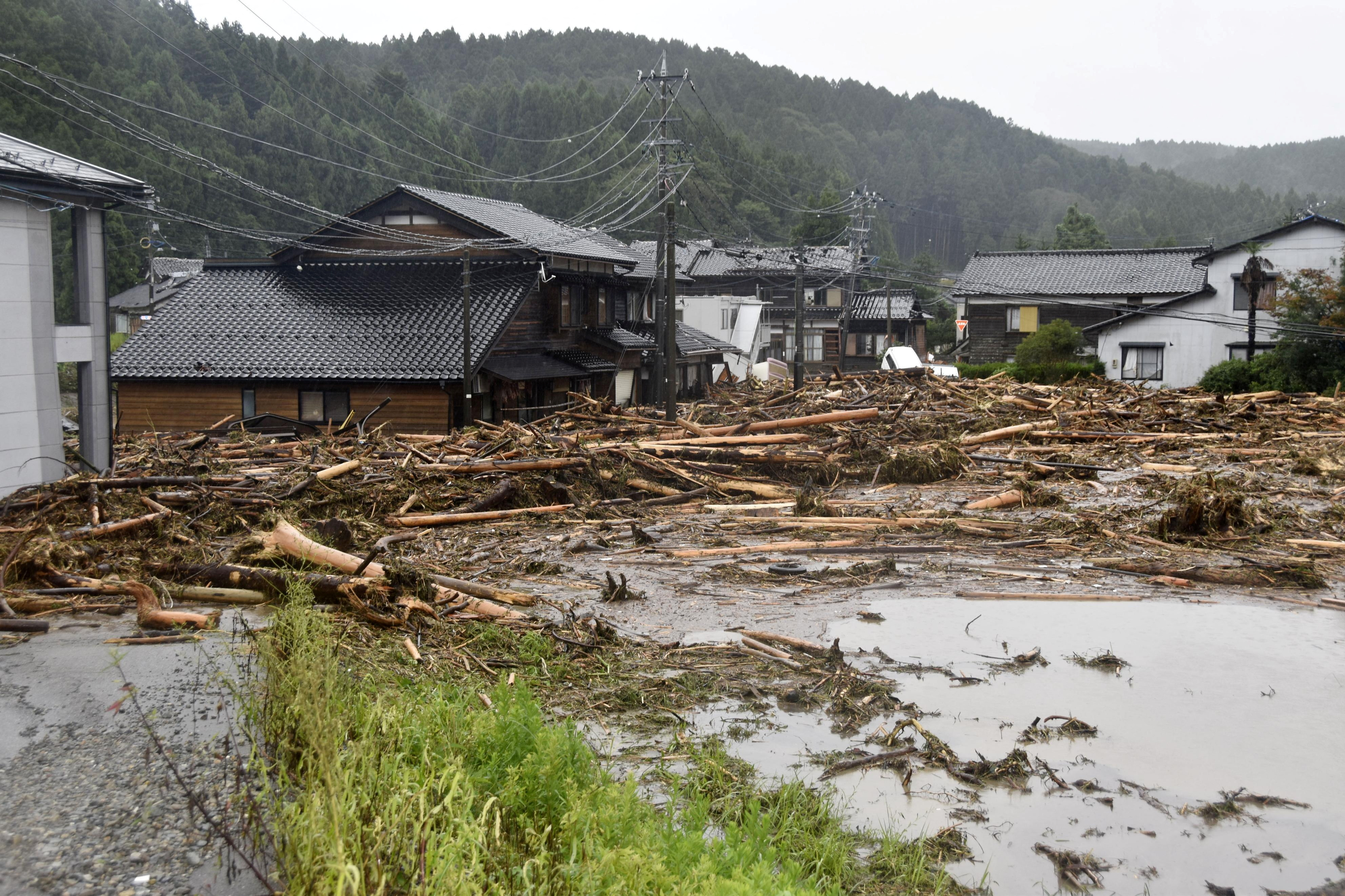 Rescuers comb muddy riverbanks after Japan floods kill six