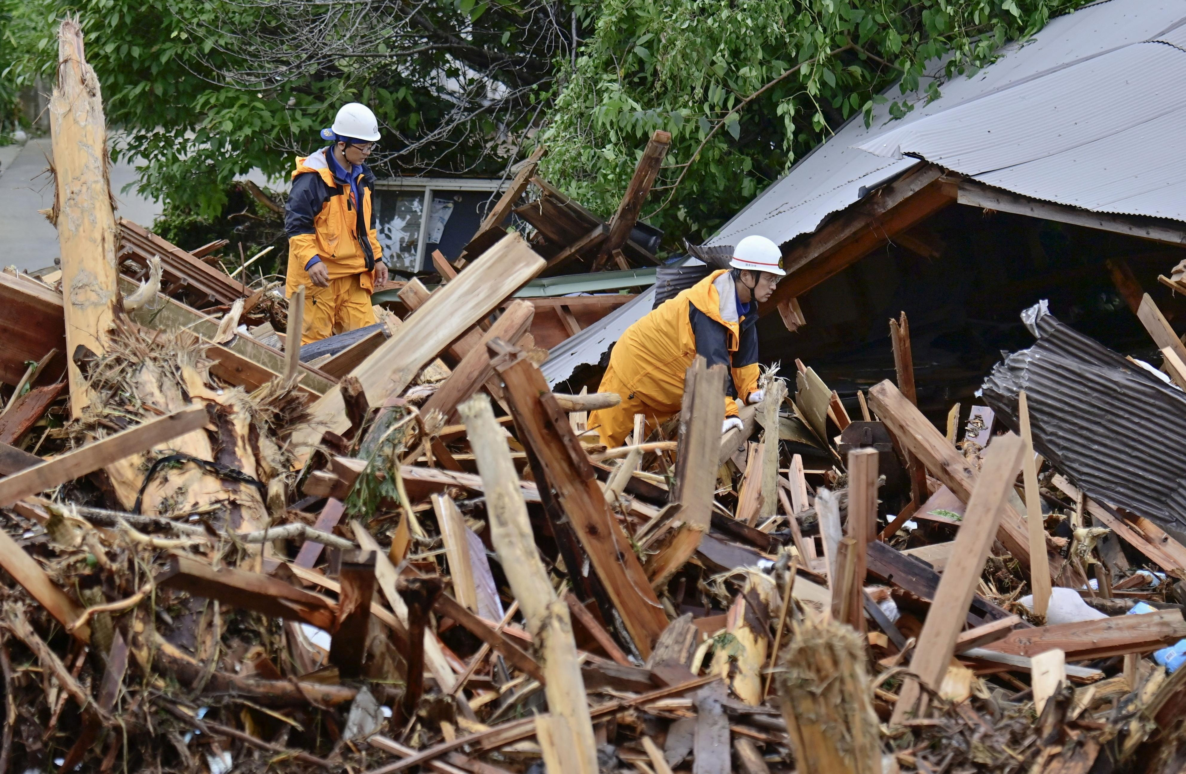 Rescuers comb muddy riverbanks after Japan floods kill six