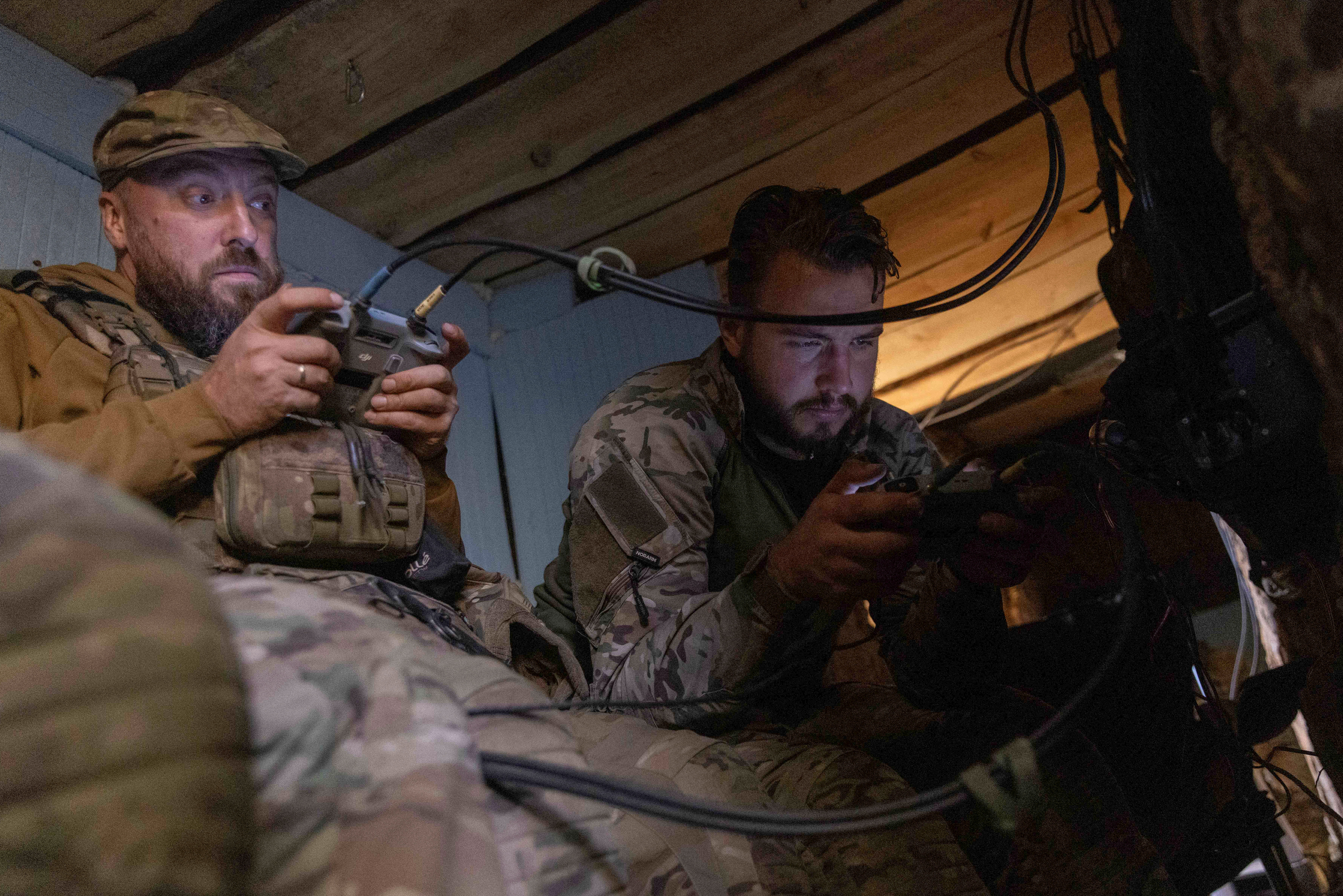 Ukrainian servicemen operate unmanned aerial vehicles at a position near a front line, amid Russia’s attack on Ukraine, in Kharkiv region, Ukraine September 25, 2024. REUTERS/Yevhen Titov