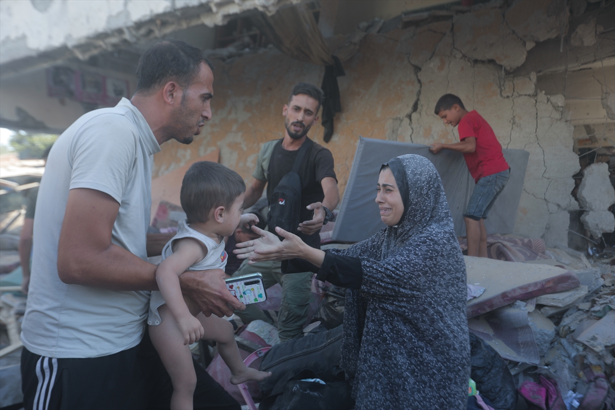 a woman reaches out to a small child with relief on her face
