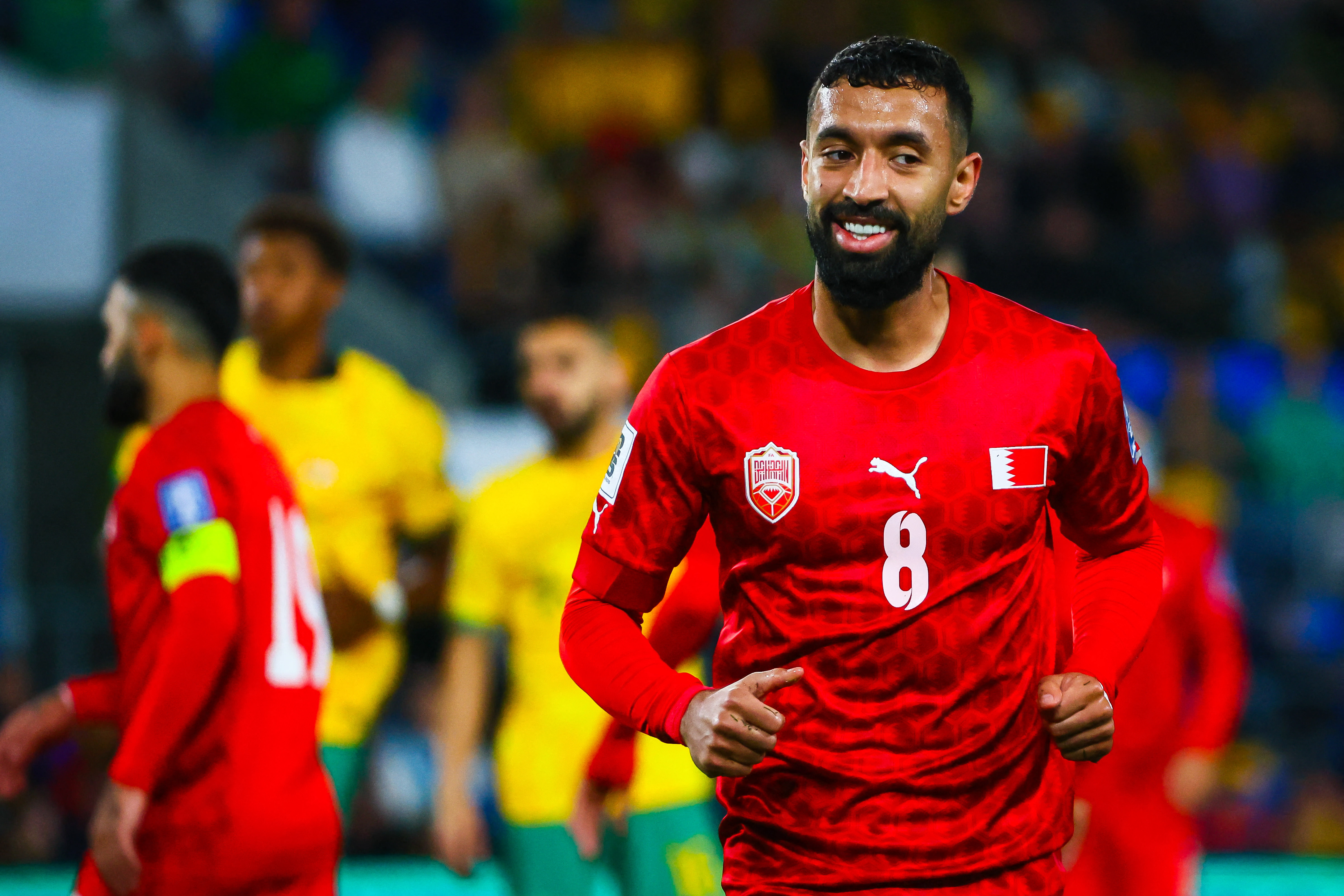 Bahrain's Mohamed Marhoon smiles during the 2026 FIFA World Cup AFC qualifiers football match between Australia and Bahrain at Cbus Super Stadium on the Gold Coast on September 5, 2024. (Photo by Patrick HAMILTON / AFP) / -- IMAGE RESTRICTED TO EDITORIAL USE - STRICTLY NO COMMERCIAL USE --