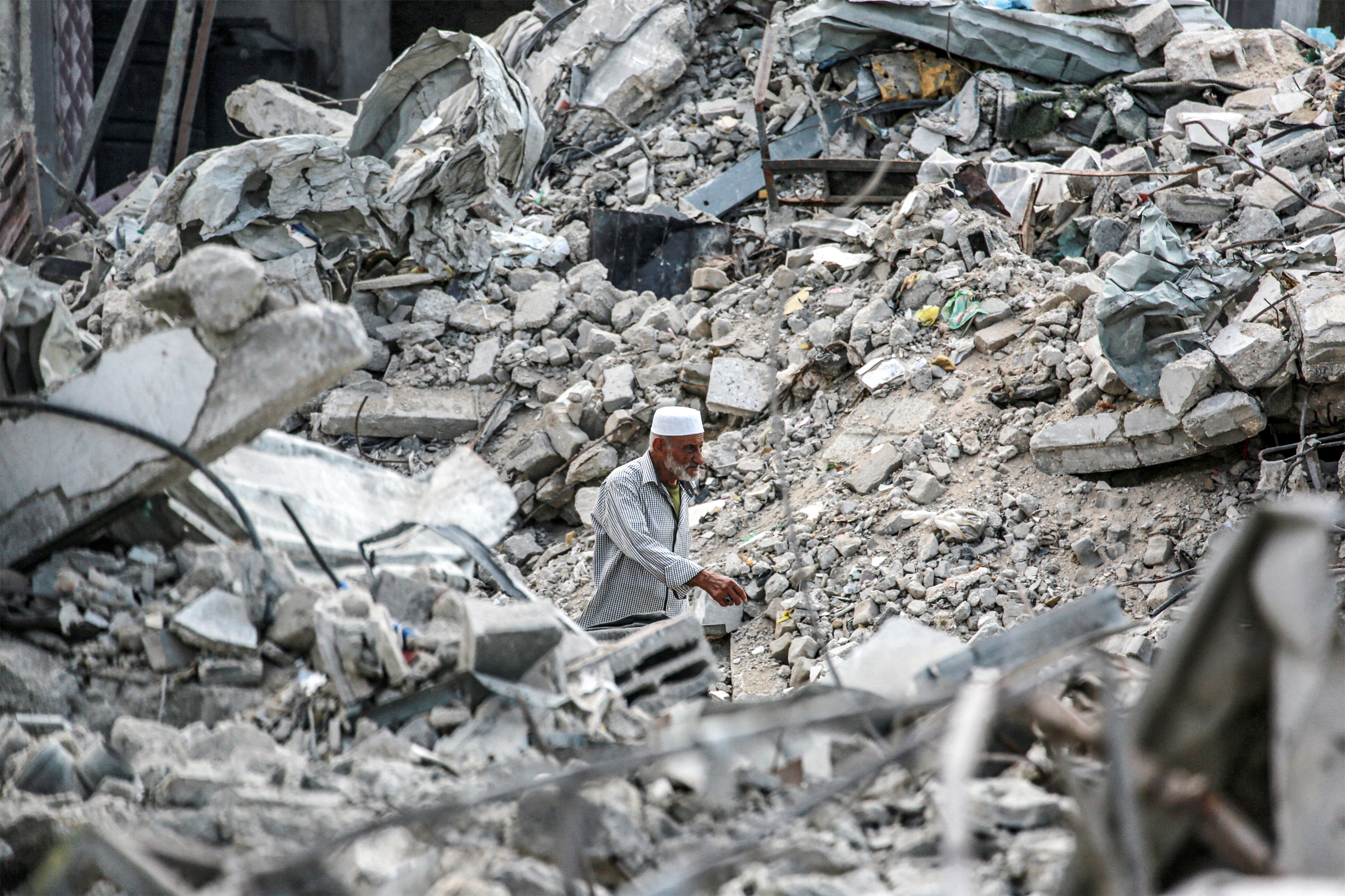 Man walks among the rubble