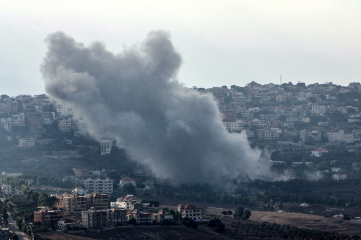 Smoke billows from the site of an Israeli strike that targeted the southern Lebanese village of Khiam on September 22, 2024 [Rabih Daher/AFP]