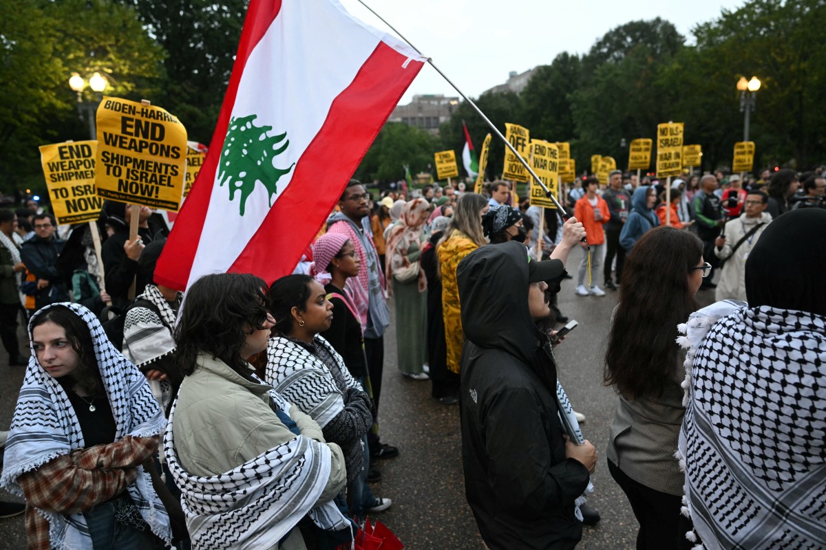 Protestors take part in a rally in support of Lebanon and call for an arms embargo and sanctions against Israel in front of the White House in Washington