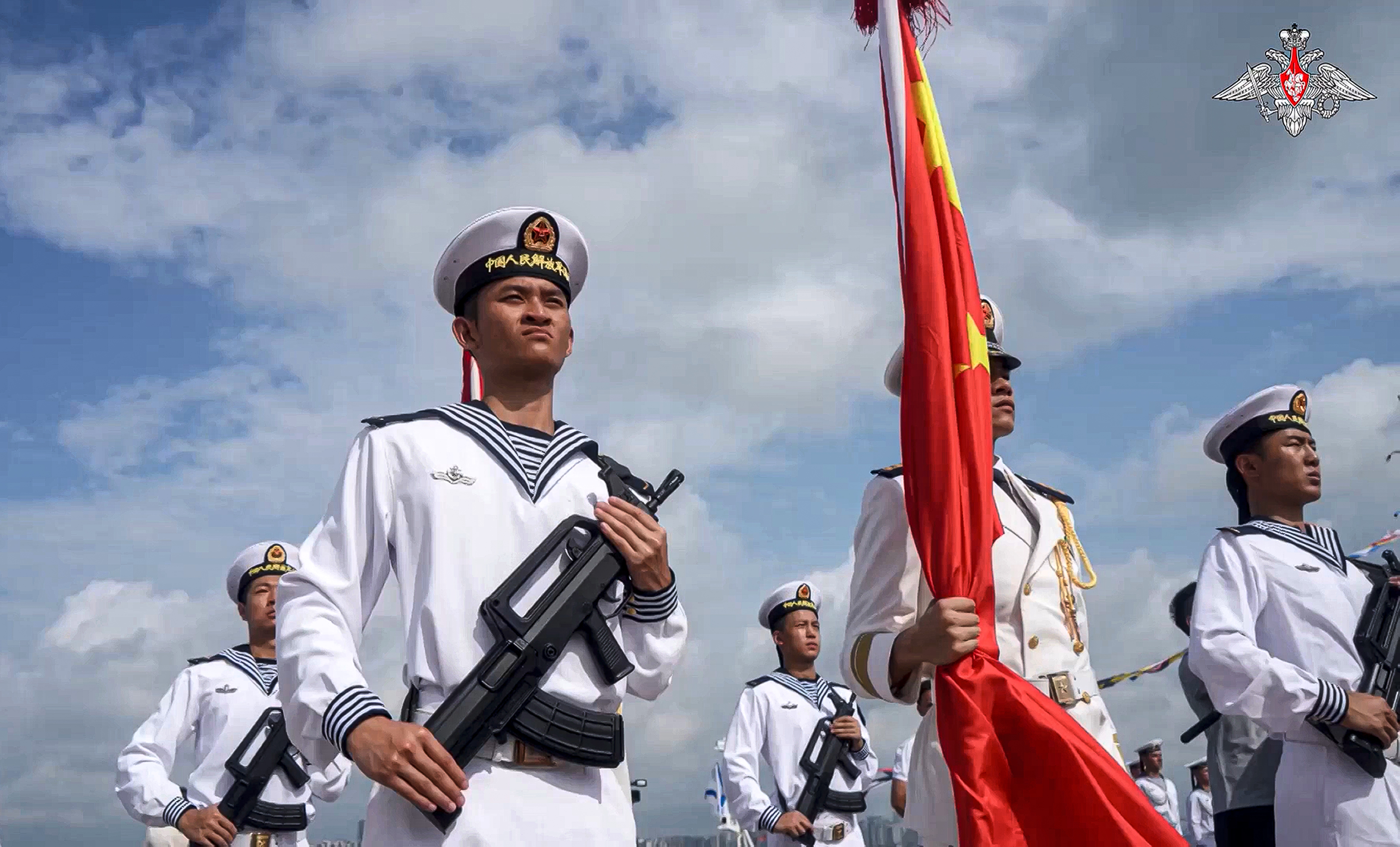 Chinese military sailors attend a welcome ceremony for their joint naval forces exercise in Zhanjiang