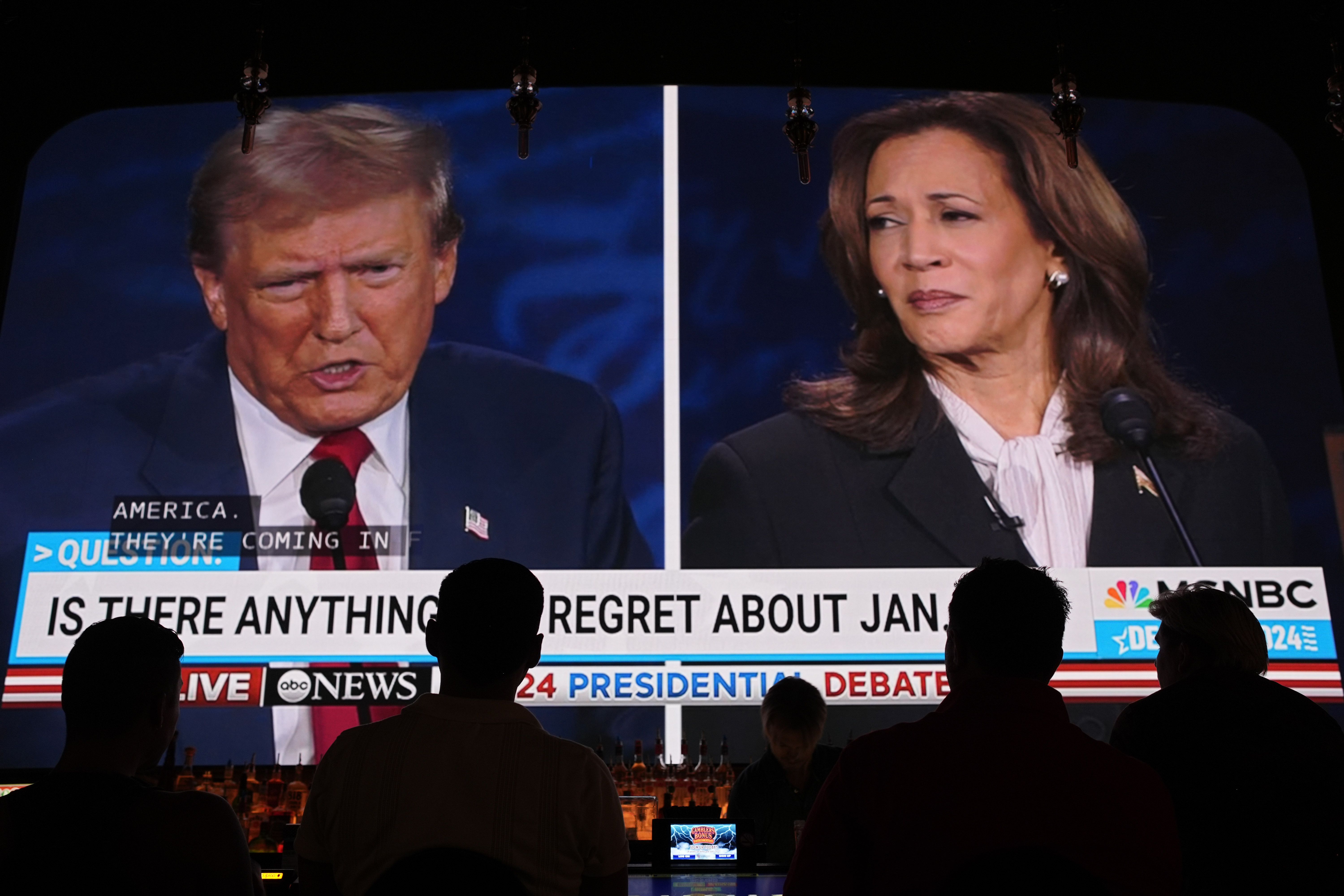 People watch the presidential debate between Republican presidential nominee former President Donald Trump and Democratic presidential nominee Vice President Kamala Harris, Tuesday, Sept. 10, 2024, at the Gipsy Las Vegas in Las Vegas. [AP Photo/John Locher]