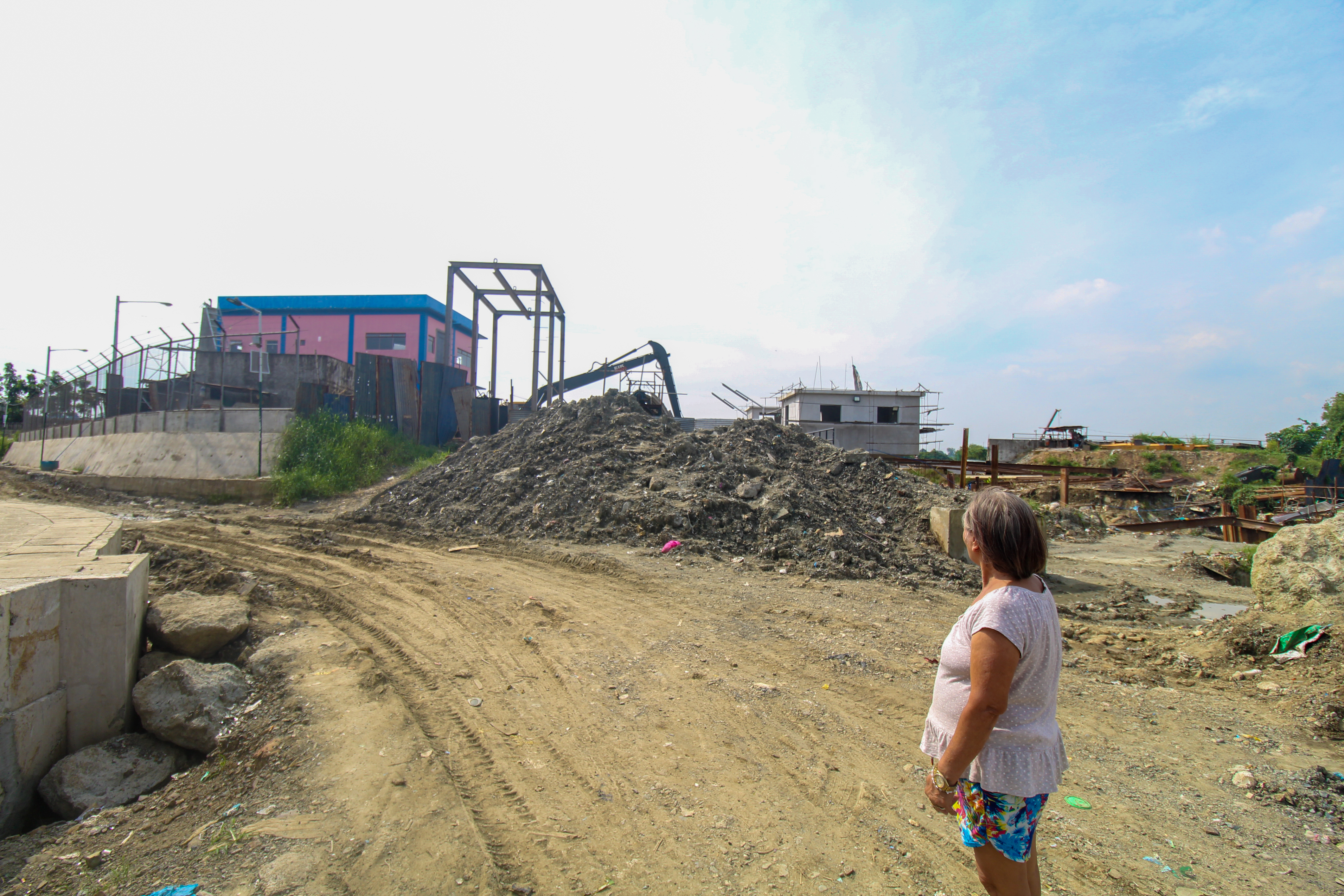 Castillo outside the pumping station near her home. It is still not finished.