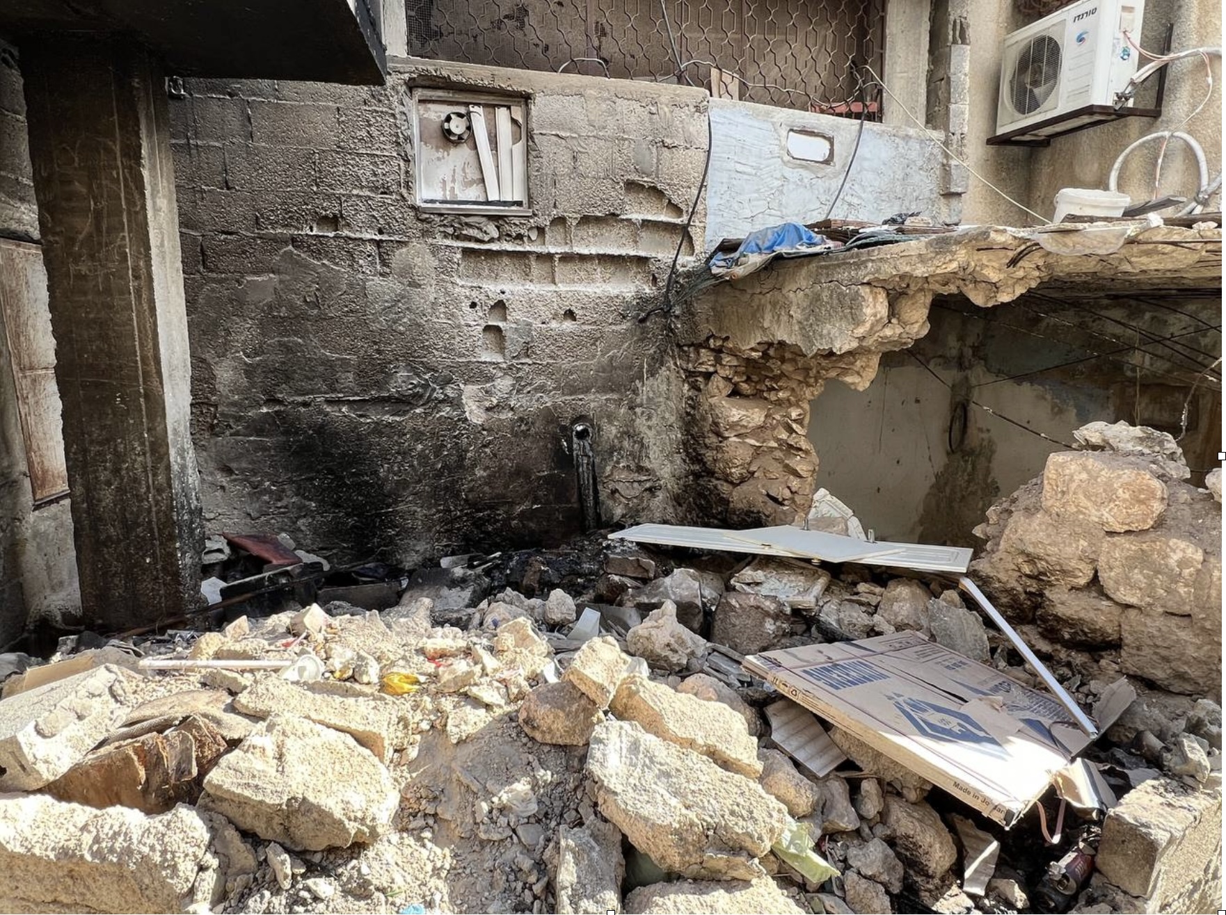 Rubble from a completely destroyed room in the family's house