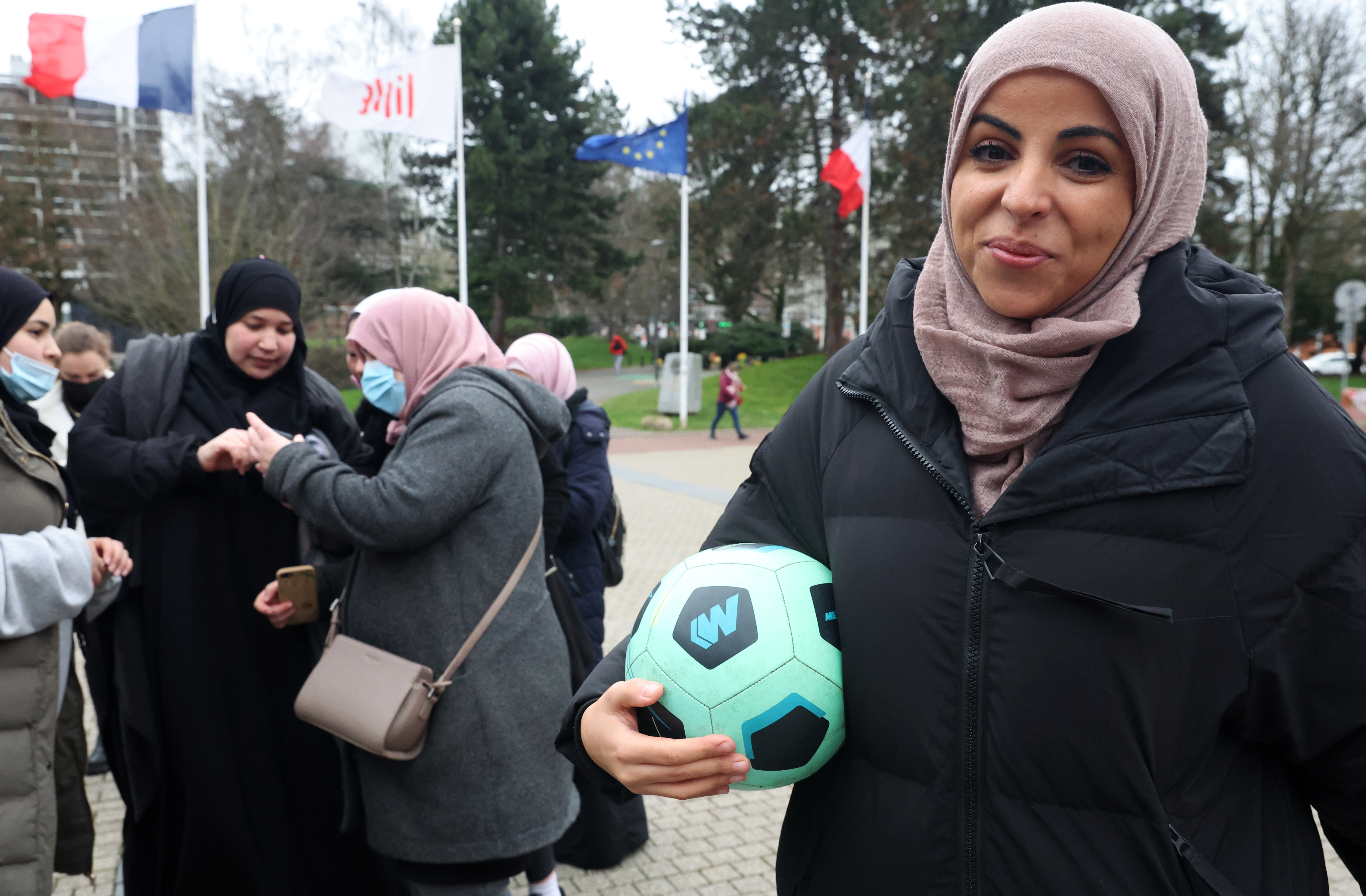Writer Majid Siham poses with a soccer ball
