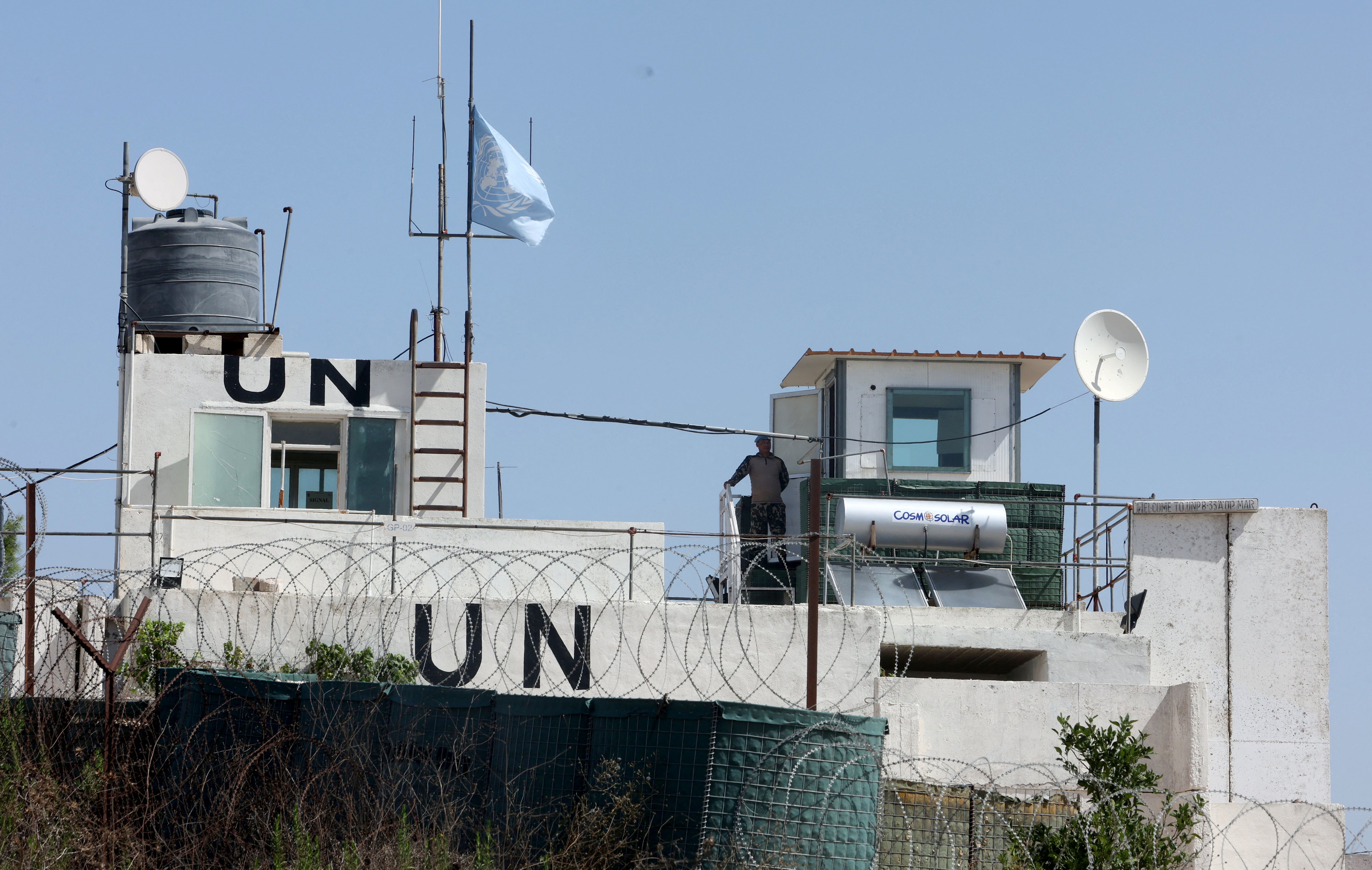 A UN peacekeeper of the United Nations Interim Force in Lebanon (UNIFIL) stands at his post in the village of Markaba, near the border with Israel, southern Lebanon, August 31, 2023. REUTERS/Aziz Taher