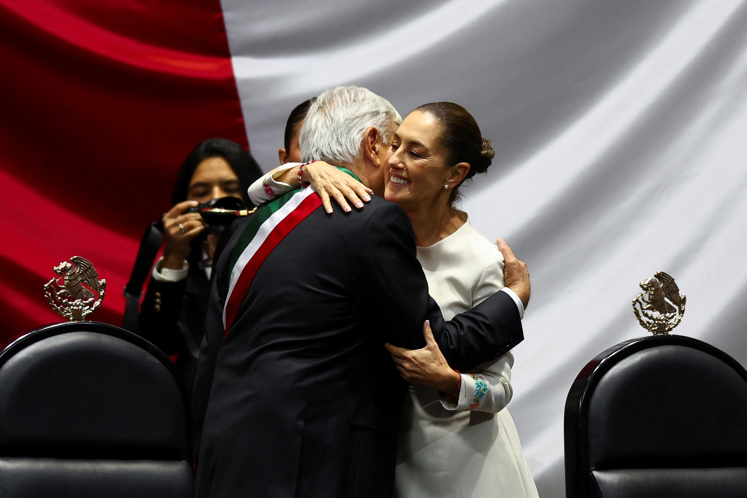 Mexico's President Andres Manuel Lopez Obrador and President-elect Claudia Sheinbaum embrace on the day of her swearing-in ceremony at the Congress, in Mexico City, Mexico, October 1, 2024 [Raquel Cunha/Reuters]