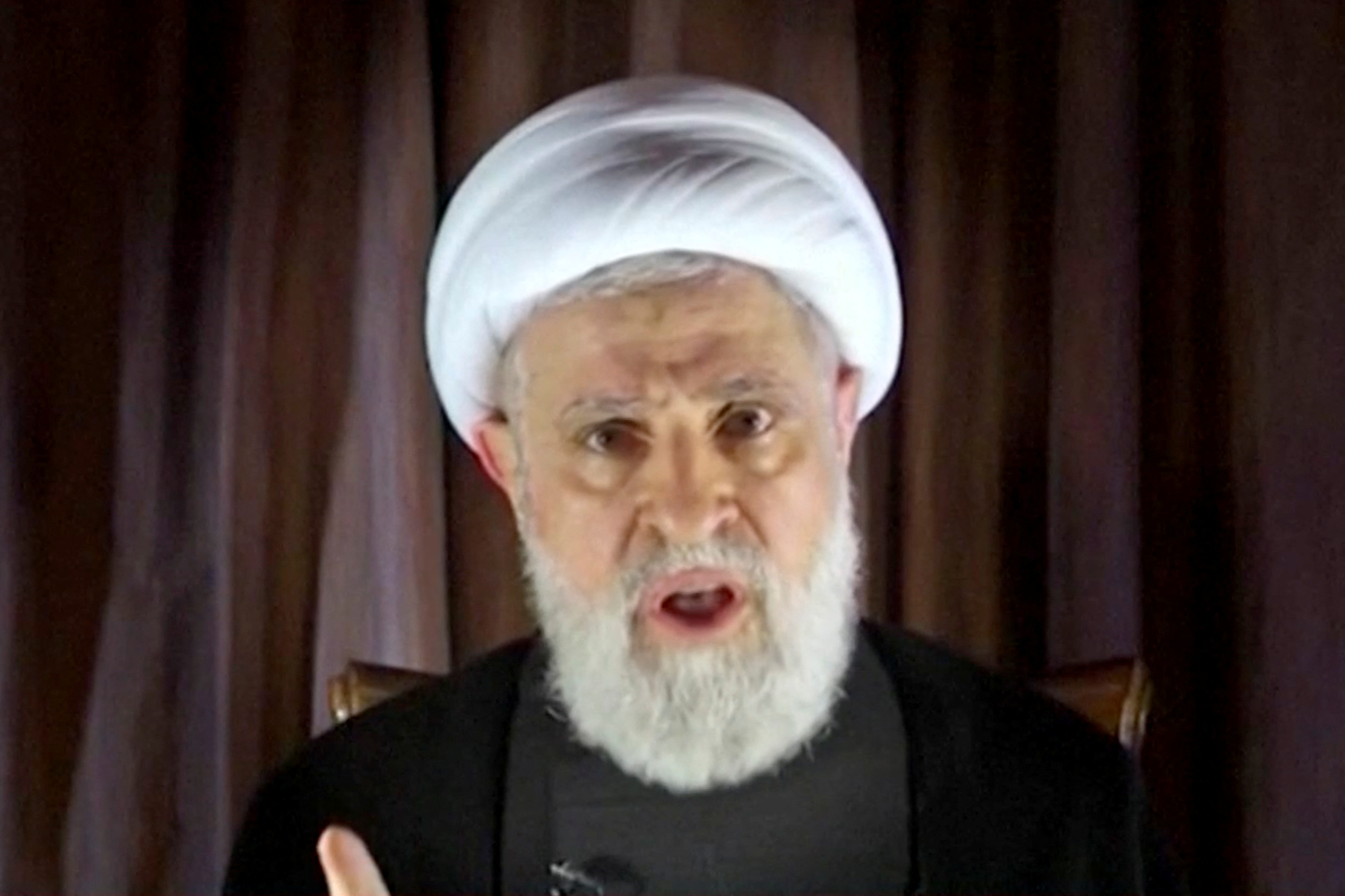 Lebanon's Hezbollah deputy leader Sheikh Naim Qassem delivers a speech as hostilities between Hezbollah and Israel increase, from an unknown location, October 8, 2024 in this still image from video. ReutersTV/Al Manar TV via REUTERS THIS IMAGE HAS BEEN SUPPLIED BY A THIRD PARTY. THIS PICTURE WAS PROCESSED BY REUTERS TO ENHANCE QUALITY. AN UNPROCESSED VERSION WILL BE PROVIDED SEPARATELY