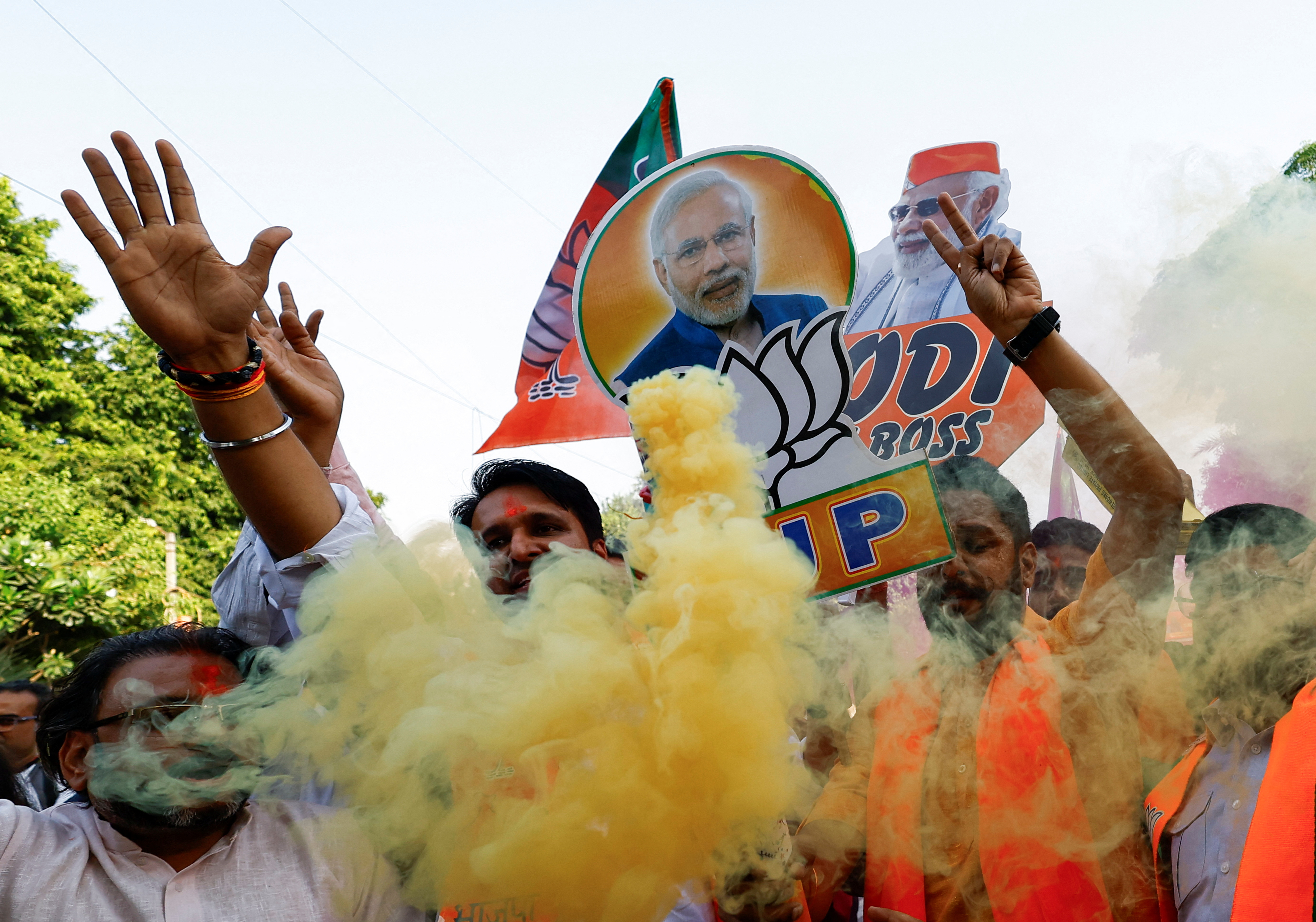 BJP supporters celebrate the election win in Haryana, outside the party headquarters in New Delhi