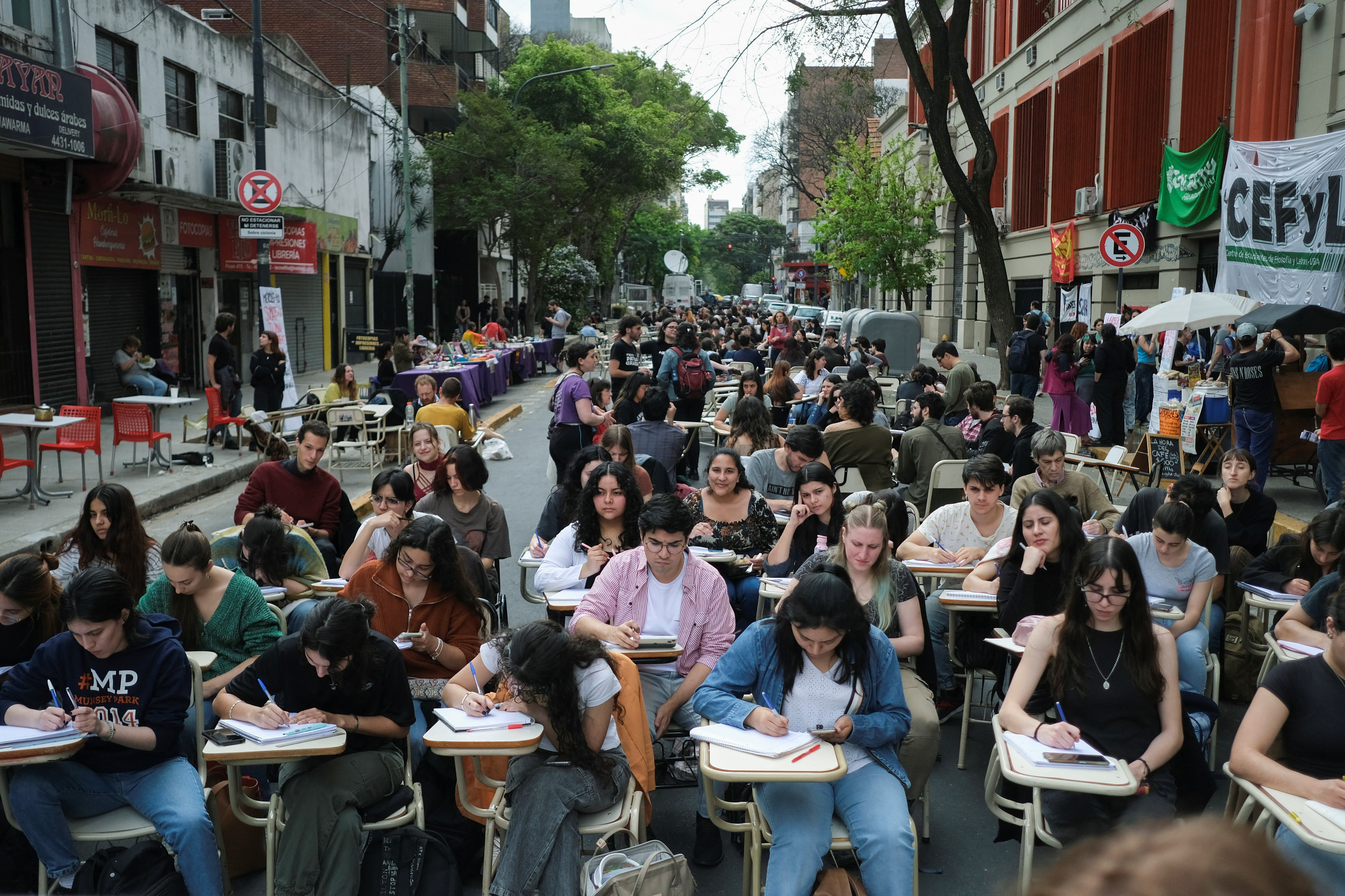 Students from the department of Philosophy and Letters at the University of Buenos Aires hold classes in the street to protest President Javier Milei's veto of a university funding law.