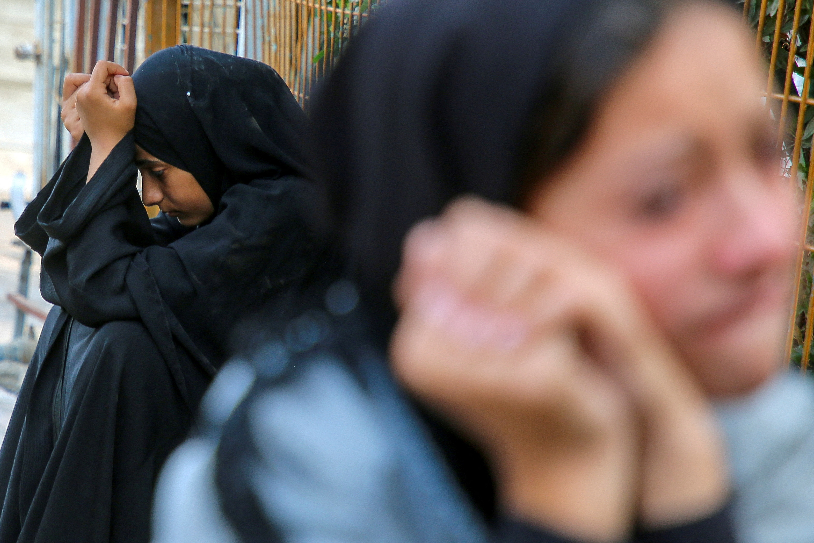 Relatives of Palestinians from Abu Taima family, who were killed in an Israeli strike, grieve during their funeral, amid the ongoing Israel-Hamas conflict, at Nasser hospital in Khan Younis, in the southern Gaza Strip, October 15, 2024