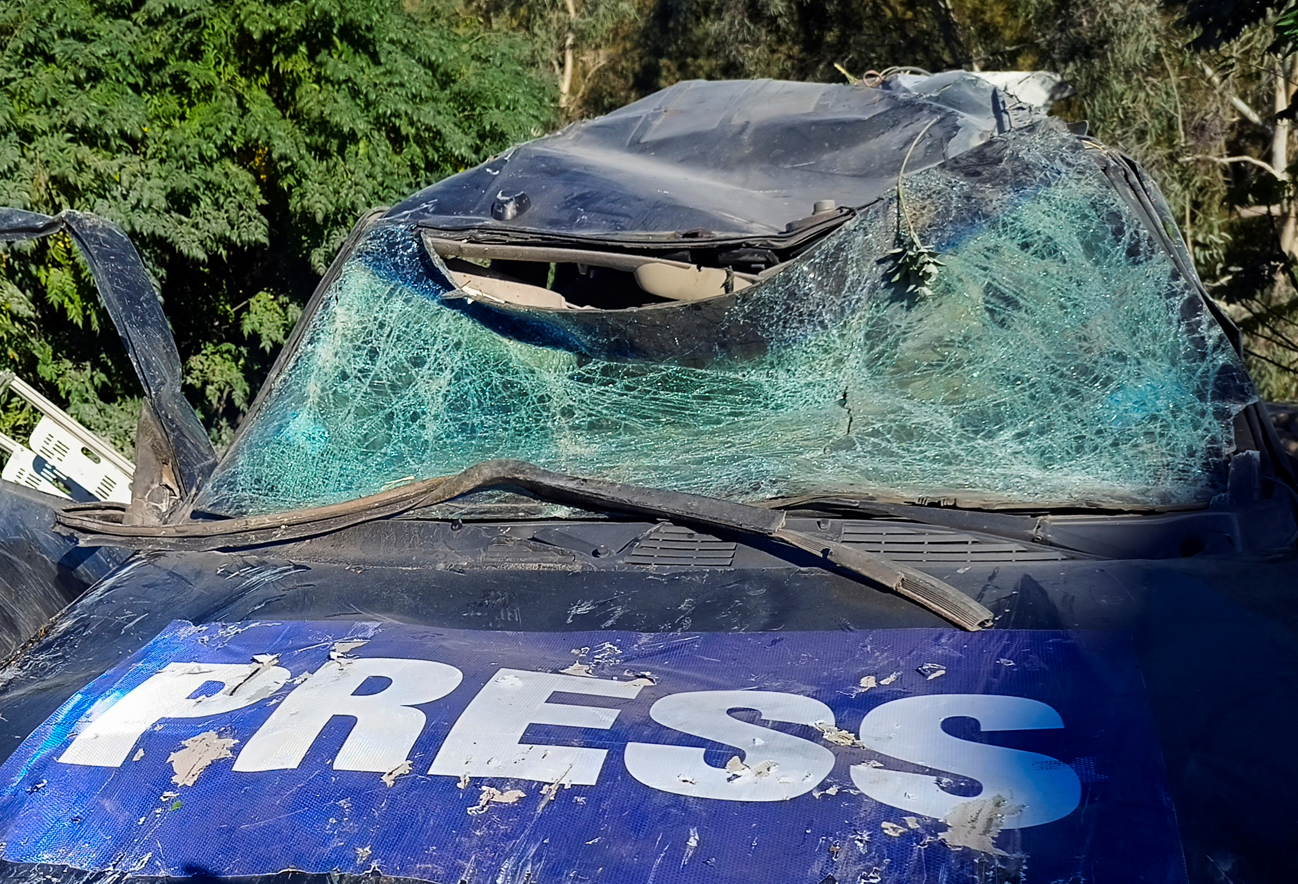 A view shows a damaged vehicle marked with 'Press' at the site of an Israeli strike that killed a few journalists and wounded several others as they slept in guesthouses used by media, Lebanon's health ministry and local media reported, in Hasbaya in southern Lebanon.