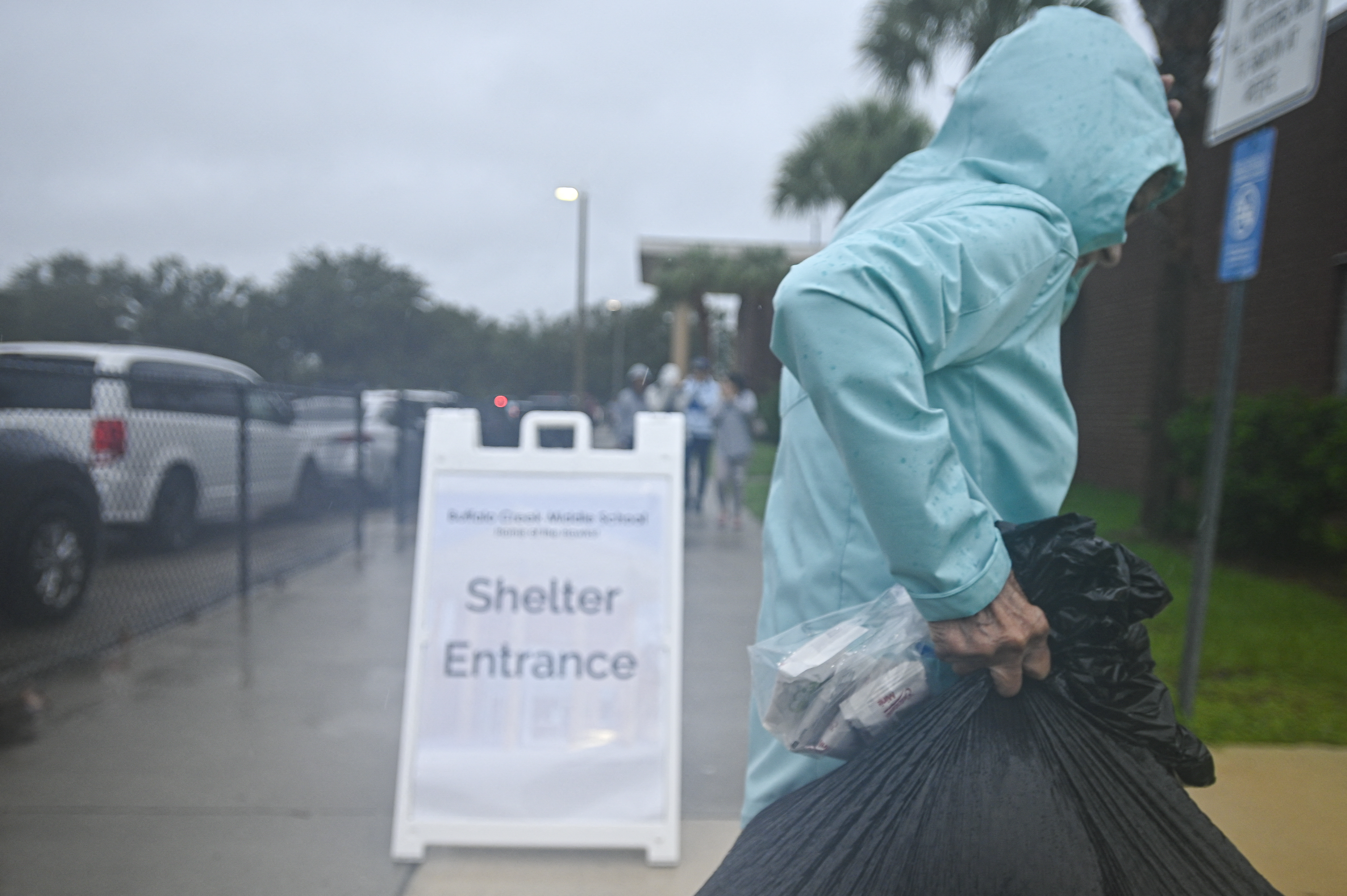 People arrive to shelter buffalo creek middle school ahead of Hurricane Milton expected landfall in Bradenton, Florida on October 9