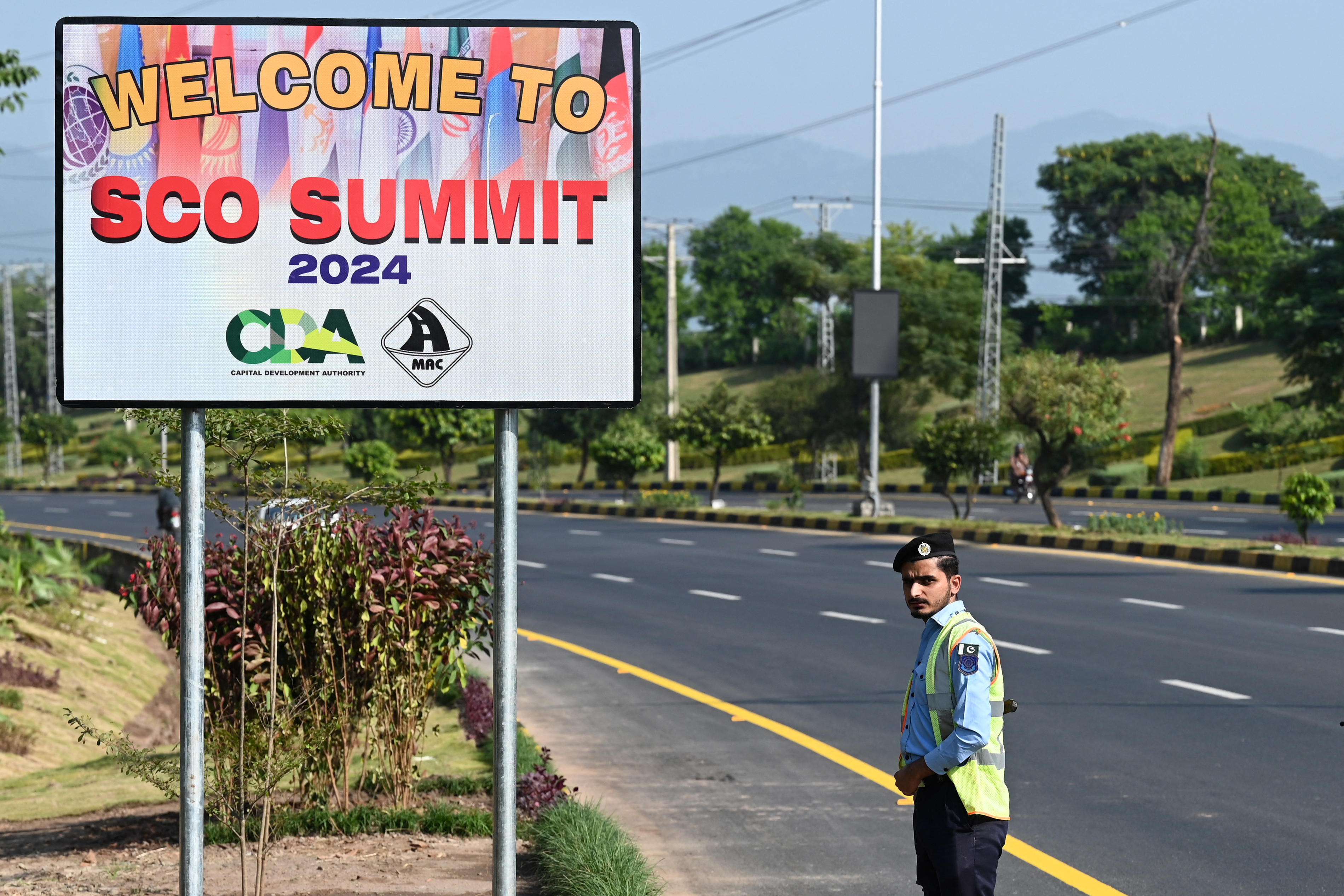 A policeman stands guard at the Red Zone near a venue on the eve of the Shanghai Cooperation Organisation (SCO) summit in Islamabad on October 14, 2024