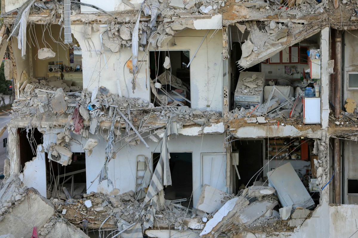 This picture shows a destroyed building at the site of an overnight Israeli airstrike that targetted a branch of the Al-Qard Al-Hassan finance group in Beirut