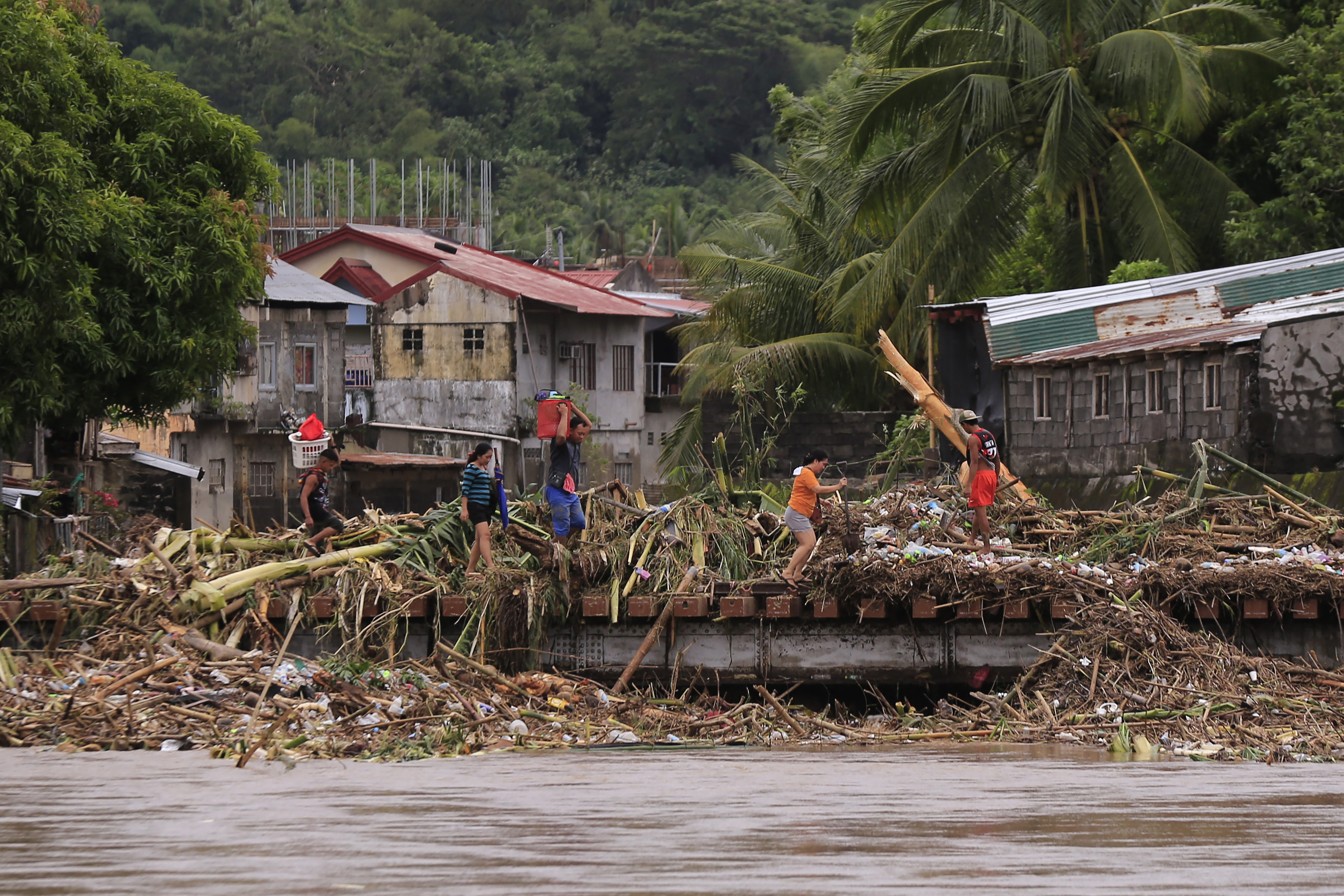 thousands evacuated as tropical storm batters Philippines