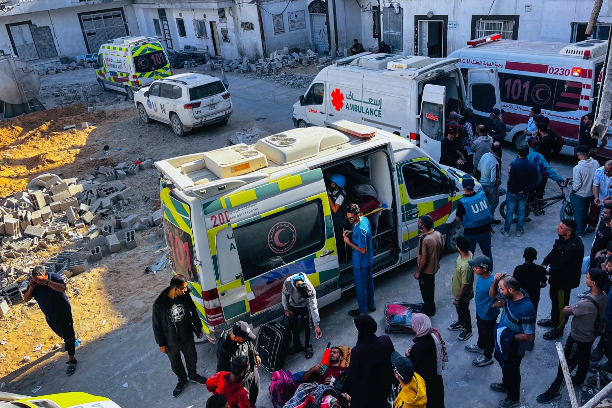 Medics evacuate injured people and cancer patients from the Kamal Adwan Hospital in Beit Lahia in the northern Gaza Strip on October 28, 2024, to al-Shifa hospital in Gaza City in a joint World Health Organisation and Palestinian Red Crescent initiative. (Photo by AFP)