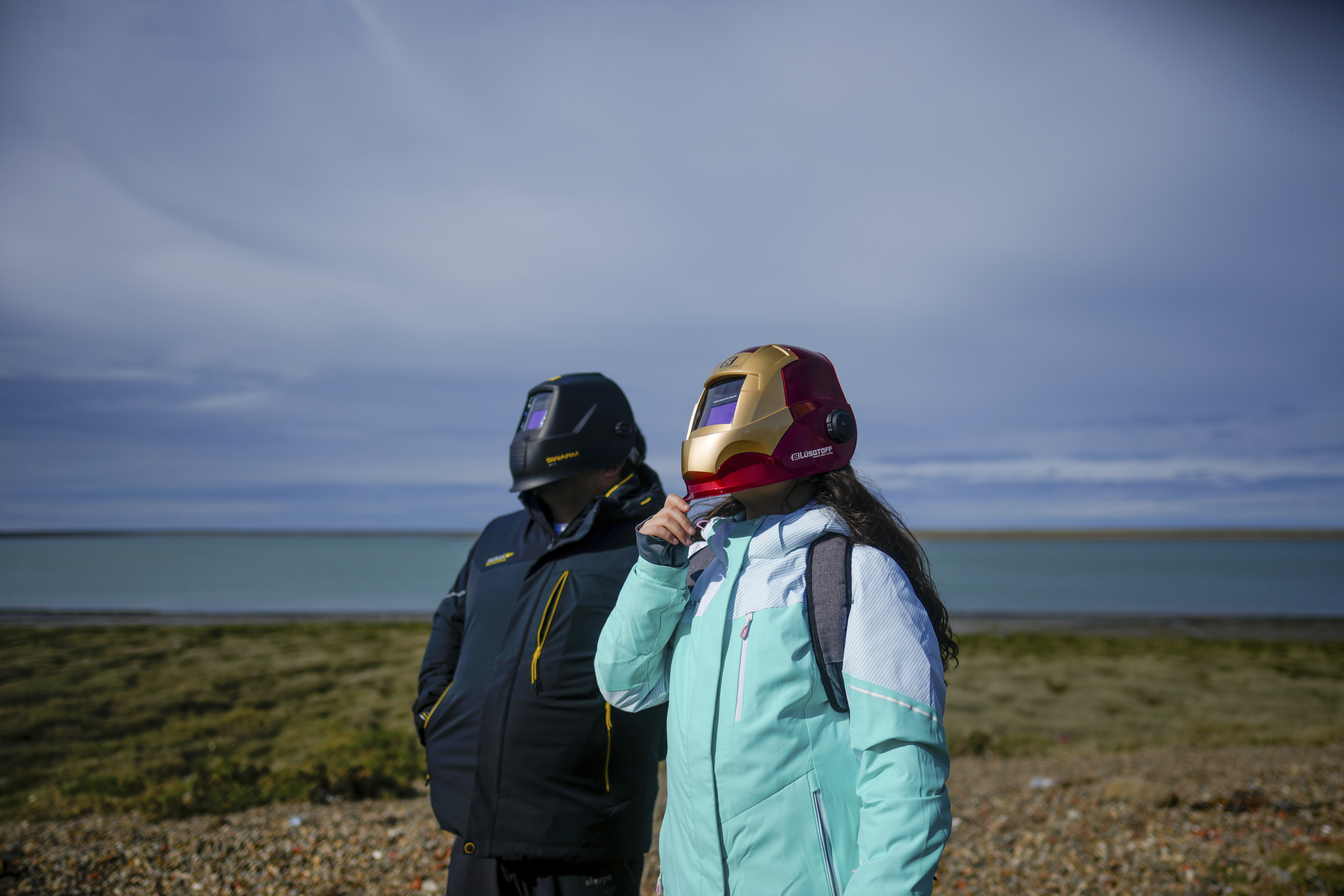 People wear a full-face mask to watch the eclipse.